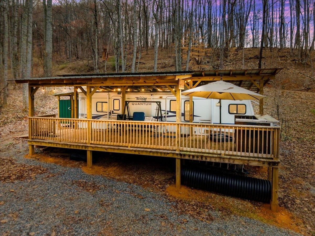 Discover an exceptional opportunity: 63 acres of pristine land in Stuart, VA—a secluded haven perfect for discerning buyers. This expansive property offers breathtaking long-range views of majestic mountains, multiple building sites ideal for a family estate, and a network of trails winding through valuable timber. Abundant with deer, turkey, bear, and wildlife, it features established food plots, a private stream, and a secure gated entrance. This “turn key” retreat includes a covered camper with a spacious porch, an outdoor shower, and a Polaris Ranger UTV. Perc tested and power-ready upon building completion, it’s just 5 minutes from Stuart, 1 hour from Greensboro, NC, 1 hour from Blacksburg, VA, and 2 hours from Charlotte. Properties of this caliber are rare—secure this treasured haven before it’s gone!