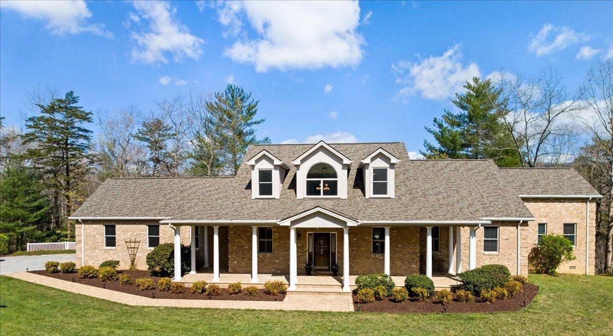 This custom-built home features low-maintenance landscaping, a relaxing front porch, a whole house generator, and a Trex back deck perfect for grilling and stargazing. Inside, natural light fills the main level, which includes elegant Pecan hardwood floors, a spacious eat-in kitchen, sunroom, two primary ensuite bedrooms, a dining room, laundry, and office. Upstairs, find two roomy bedrooms & bonus room with updated carpet. The walk-out basement offers a large recreational room for versatile activities. Each level boasts stunning mountain views. The easy-care yard provides privacy and ample outdoor space. Conveniently located with quick access to both Roanoke and New River Valley, this move-in-ready home combines tranquility and convenience.