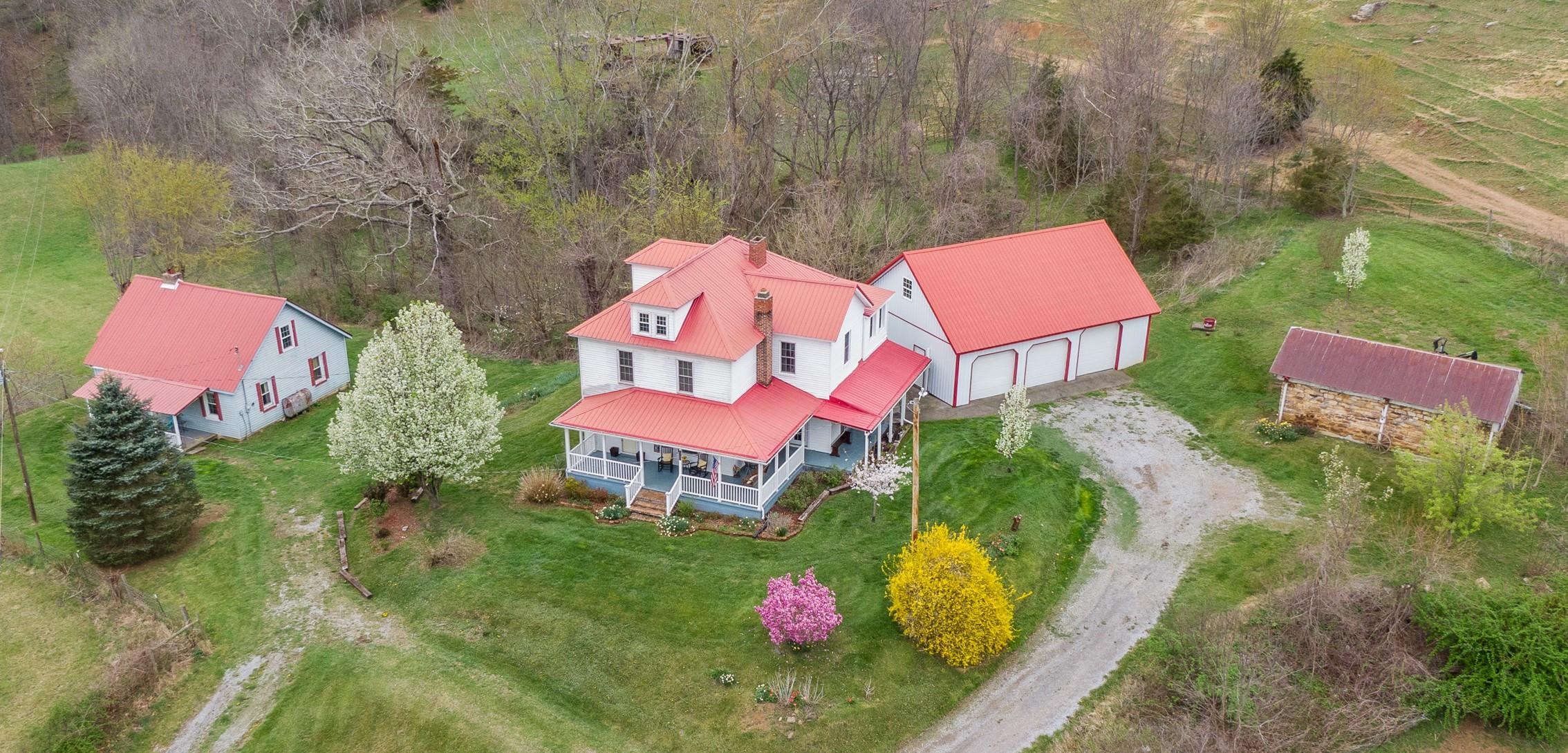 This unique property offers a beautiful farmhouse as the main house (2,340 Sq. Ft.), an additional home as a guest home/mother-in-law home, etc. (1,164 Sq. Ft.), a detached 3-bay garage (40'X30') w/heat & electricity, and another stone garage (28'X16') - all picturesquely situated in a country setting on 2 acres!!  This property is a rare find, offering flexibility, comfort, privacy, space and gorgeous views from the wraparound porch!! There are too many amenities/details to list here!! Schedule a showing today!!