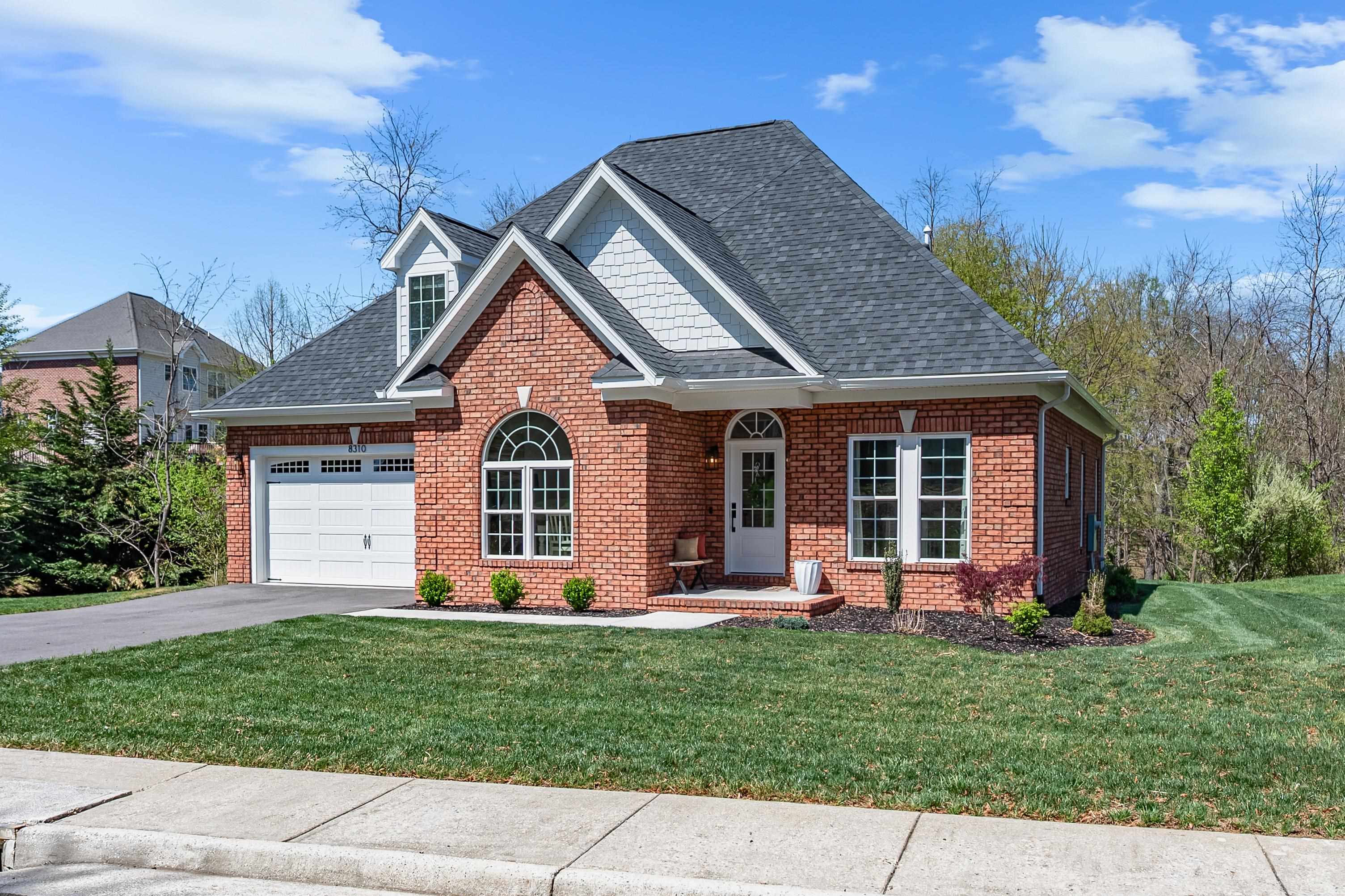 Discover refined living at 8310 River Course Dr in Radford, offering exceptional quality at a competitive price point. This meticulously built residence features three bedrooms, each with private bathrooms, plus an additional half bath. The elegant primary suite on the main level offers convenient accessibility with modern finishes throughout. The stately foyer welcomes you into this solid brick exterior home. The heart of the house showcases a gourmet kitchen appointed with KitchenAid appliances, gas range, and stunning quartz countertops. A dedicated dining room creates the perfect setting for memorable gatherings. Outdoor entertaining becomes effortless on the extensive Trex deck, while practical luxury continues with a fully conditioned attic for additional storage needs.  Located in a neighborhood adjacent to Pete Dye River Course of Virginia Tech and approximately 15 minutes to Virginia Tech's main campus, this new listing combines sophisticated design.