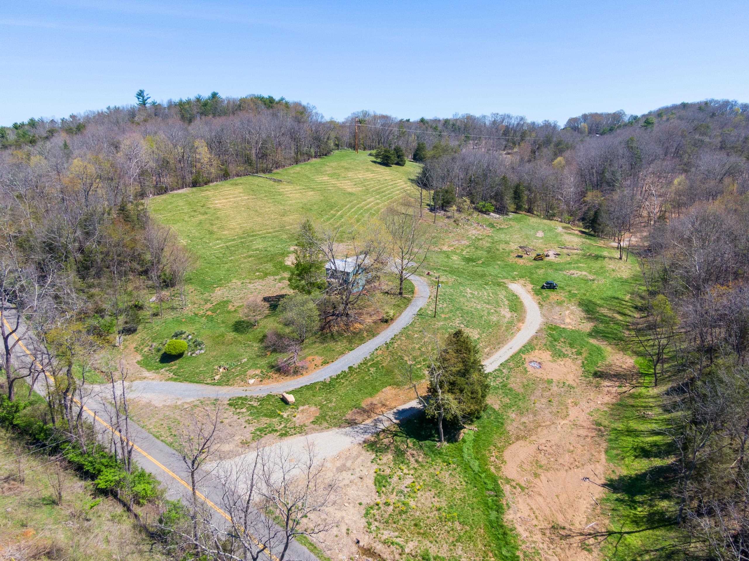 Looking for the perfect place to build a home?  Auburn school district, 5 minutes to NRV Medical Center and I-81, yet with the privacy of over 48 acres?  This is the place for you!  Partially wooded/partially cleared land with a beautifully cleared 1+ acre spot on the top with a view.   Driveway cut in and perked for a 4 bedroom home.   Farmhouse on property used as storage and being sold as-is.  Don't miss this rare find, make your appointment today!
