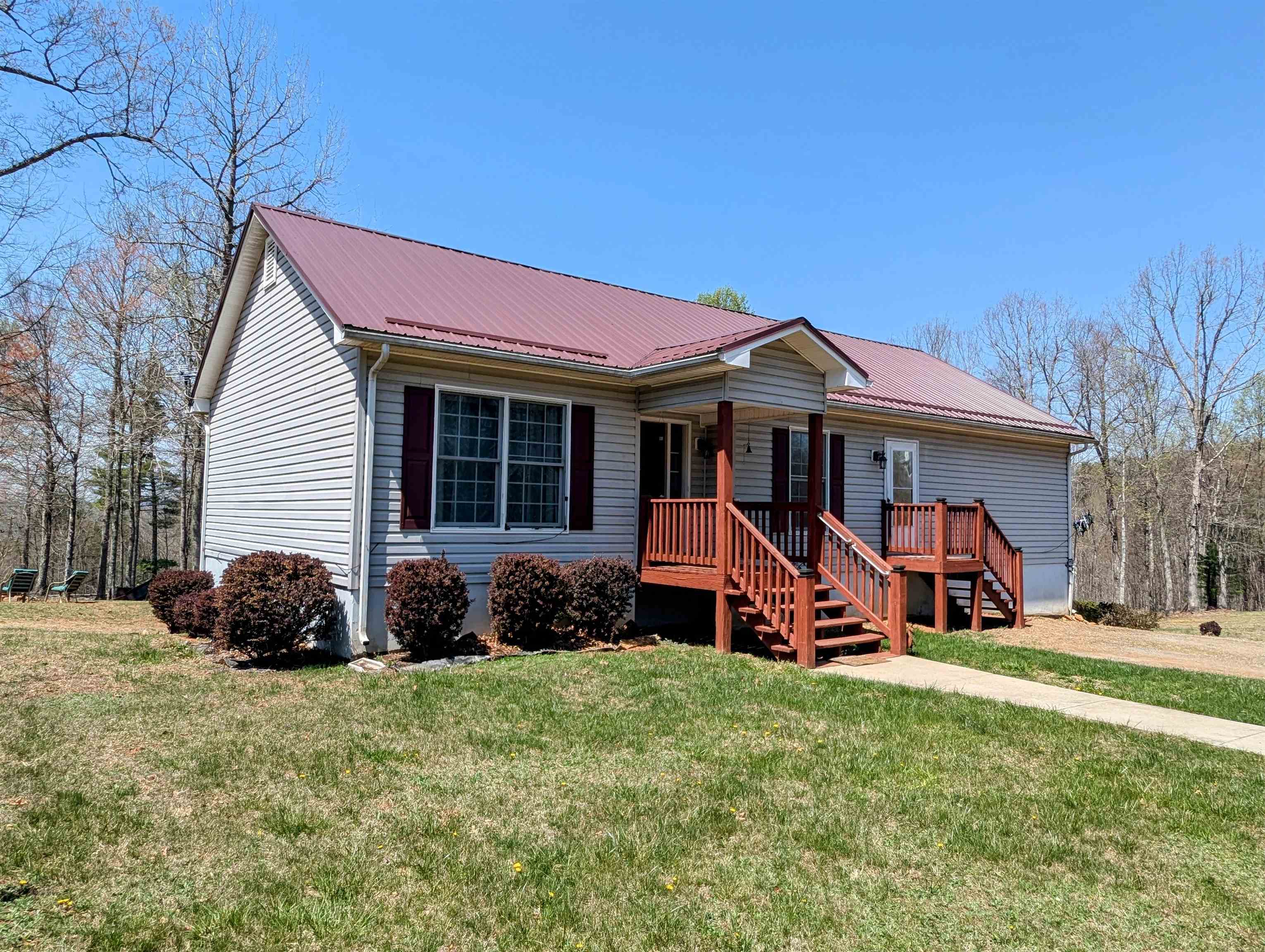Check out this 3 BD / 2.5 BTH country home in beautiful Laurel Fork VA!  This home is positioned on over 6 acres and offers an amazing view from the back porch and firepit area.  A spacious main level with the majority of the lower level offering finished square footage for a combined total of nearly 2,500 sq ft.  Recent upgrades include a metal roof, water purifying system, remodeled baths and let's not forget the whole home Generac Generator system!  If your looking for quiet this property is located on a private drive but yet still close enough for a quick trip to Meadows of Dan, Floyd, Stuart or Hillsville VA.