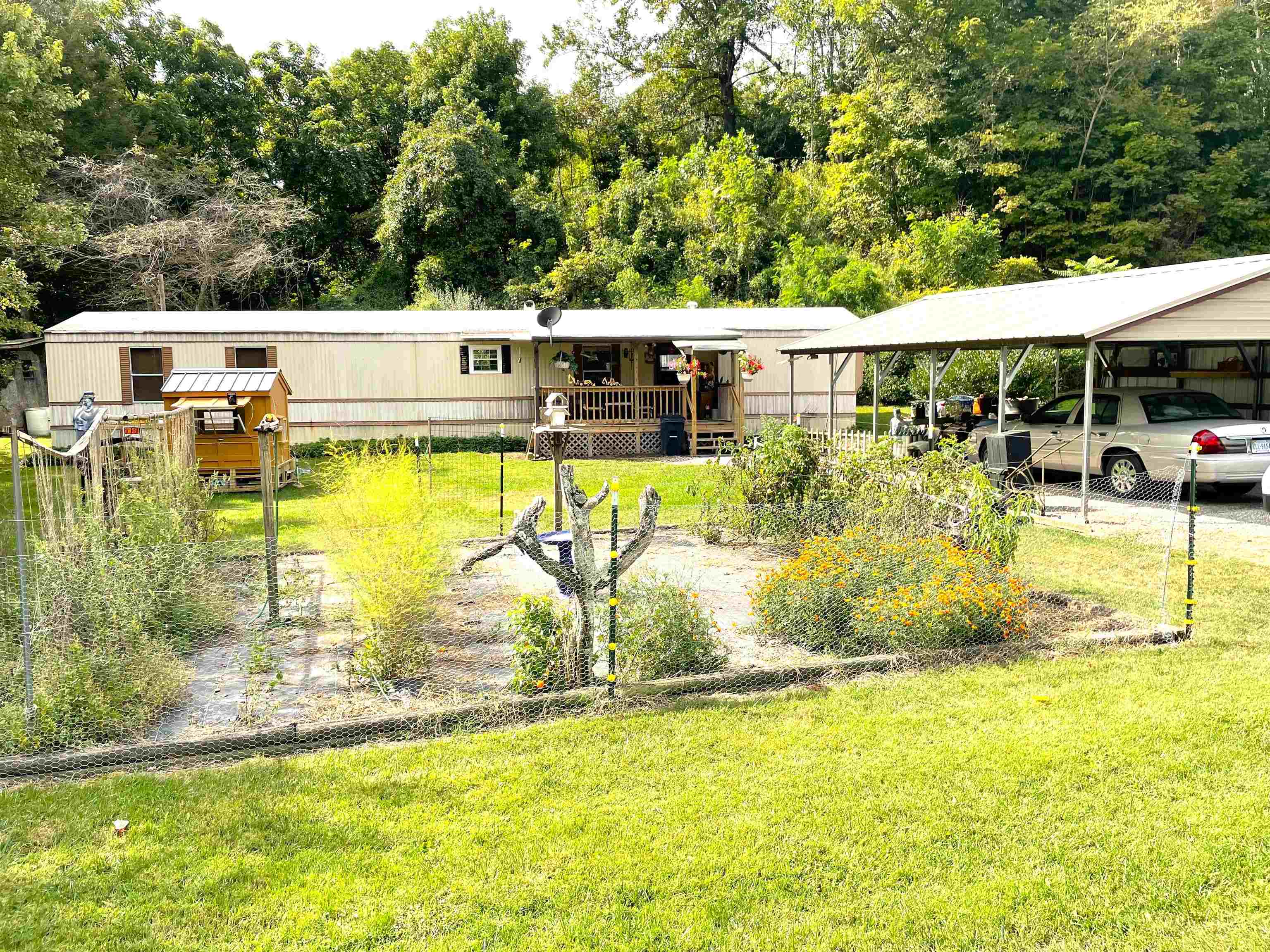 Well maintained home on a large, level lot. Bring the animals! This home borders a creek, has 2 small barn structures and is partially fenced. The 2 bedroom residence has 2 newly updated bathrooms with walk-in showers, vaulted ceilings, laminate floors in the living areas, newer carpet in the bedrooms and a wood stove. HVAC updated in 2017! The 1 acre lot also has a detached garage/workshop. It has electricity, heat and a seperate room for storage. Only a 15 minute drive to VA Tech and close to hiking trails and other outdoor activities.