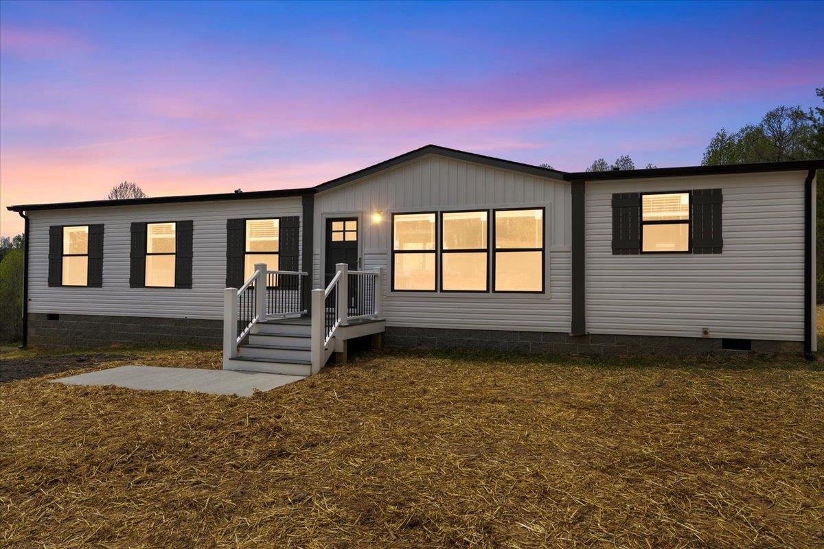 Escape to the charm of country living with this BRAND-NEW, beautifully crafted 3-bedroom, 2-bathroom farmhouse-style home offering 1,568 sq ft on a sprawling 1-acre lot. Perfectly positioned just minutes from Interstate 77, this property combines the serenity of rural living with easy access to nearby conveniences. The heart of this home is its inviting open-concept design, featuring a gorgeous kitchen, complete with a spacious island, sleek appliances, and a show-stopping barn door pantry for ample storage. Both bathrooms boast double sinks, offering comfort and functionality for busy mornings. Designed for easy living, the home features low-maintenance Trex decking and vinyl exterior, ensuring effortless upkeep. With its blend of contemporary upgrades and farmhouse character, this home is an ideal retreat for those craving space, comfort and convenience. Don’t miss out on this Carroll County gem- schedule your showing today! Owner/Agent