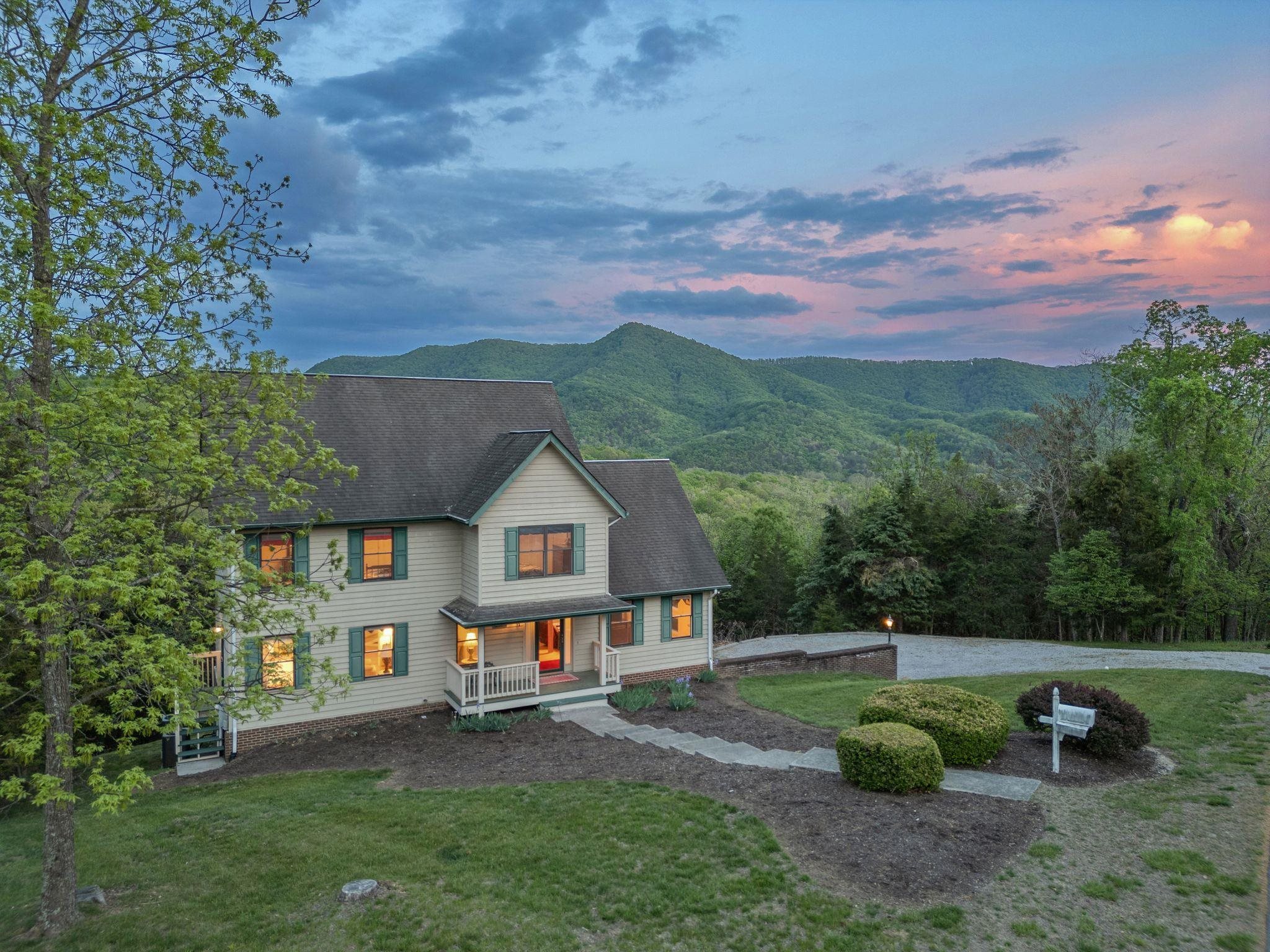Nestled in the mountains of the Blacksburg Country Club, this home will be perfect for full time owners or as your Hokie Haven for Gameday weekends!  Outside of town limits so no restrictions from the town on AirBnB.  There is an additional lot included if you wanted to build a second home here as well!  This home has three bedrooms upstairs including a Primary with great mountain views from the private deck.  In the basement is a 4th (non-conforming) bedroom with its own en suite bath.  Gorgeous mountain views from the living room, dining room, and back deck allow for a relaxing atmosphere..  Just minutes from the Blacksburg Country Club Clubhouse (inquire with BCC for membership).  Come see this home today!
