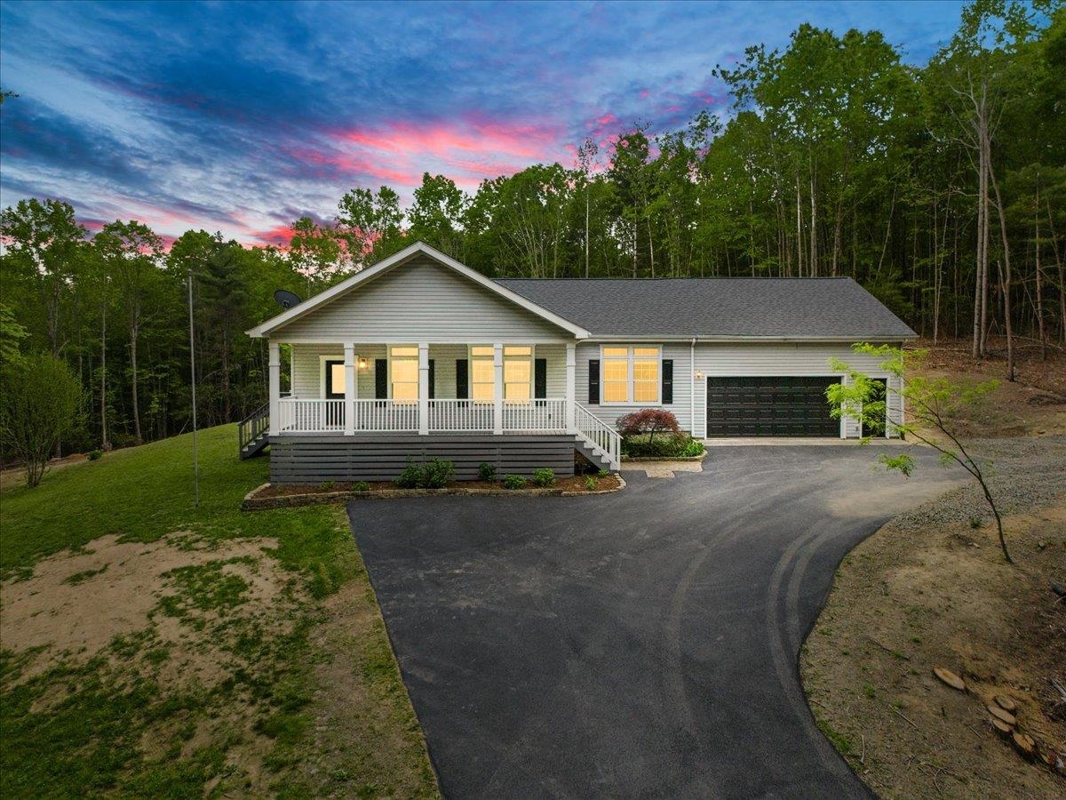 Uncover a hidden gem at 904 Dusty Rock Rd NW, Riner, VA—a 3.26-acre slice of paradise built in 2006, where privacy and peace welcome you. This main-level living beauty boasts 3 bedrooms, 2 full baths, soaring 9' ceilings, spacious kitchen and a crackling fireplace for cozy nights. The expansive master suite steals the show with a walk-in closet, double sink vanity, and a luxurious garden tub for soaking away the day. A babbling creek weaves through the wooded lot, creating your own serene oasis. The attached oversized 2-car garage, complete with bonus storage above for all your gear, provides ample workspace. Just 15 minutes from Christiansburg and 20 minutes from Floyd, you’re close to town but worlds away in this tranquil retreat. Properties like this don’t linger—snag your secluded haven before it vanishes!