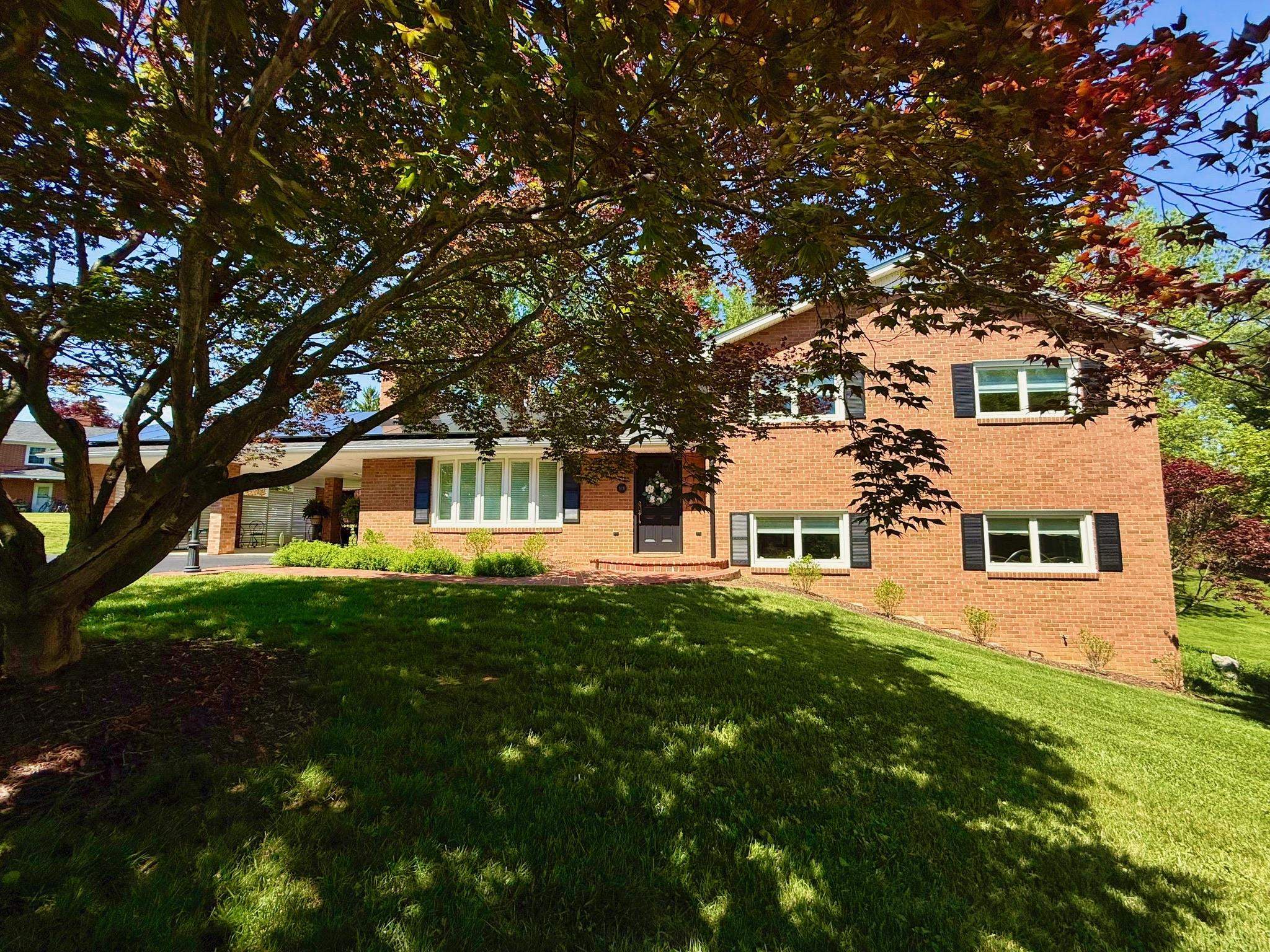 You will not find another home like this anywhere! Absolutely meticulous inside and out! Every detail has been attended to. 4 sided brick so low maintenance. The landscaping includes a little pond with waterfall, a landscaped  shed, multilayered deck with trex type boards, the carport is fixed for entertaining with TV, fans and upgraded flooring. The home is a jaw dropper. So many different areas and rooms, when you think you have seen it all, there is more.Don't miss the in-law suite with it's own door! Open every door, or you will miss something. Very open floor plan on main with a great kitchen with cherry cabinets and the dishwasher and refrigerator has cherry facade. Jenn Air Oven. Nest thermostat, ATT security, Wifi everywhere. Continuous-flow gas water heater. See all the photos and it will hint at what you are going to find. This lower level is like none you have ever seen. And all of this within walking distance to downtown, and VT.  The lot beside the home is included.
