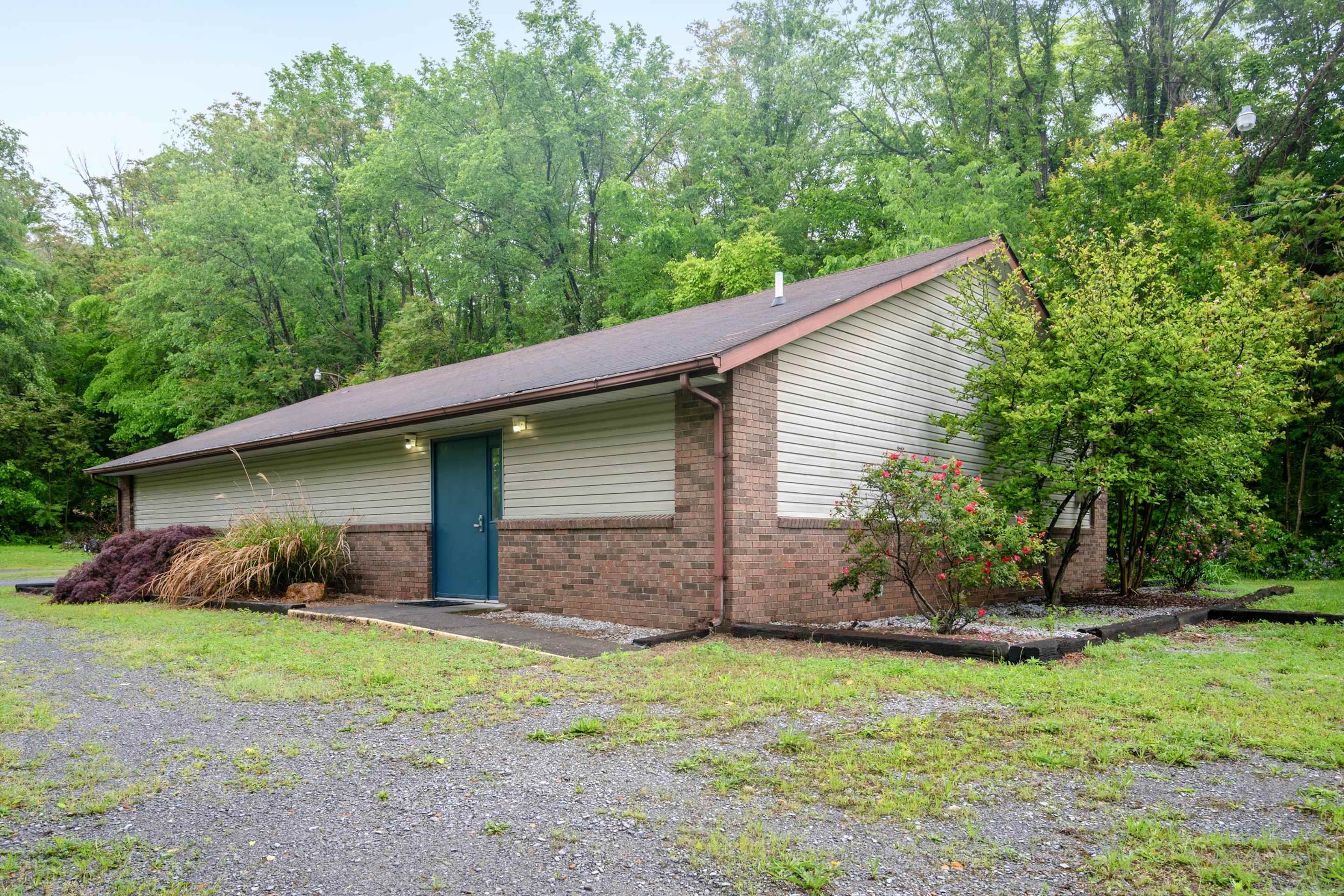 Discover a one-of-a-kind opportunity to own a well-maintained property that offers great functionality and possibilities. Once a church, this 2,000+ Sq. Ft. building has been thoughtfully repurposed as a storage facility for a contractor over the past 5 years. This property also features two half baths, an office, heat pump, public water and sewer and an additional storage building. This property is perfect for continued use as a storage facility with a commercial size garage door, and an abundance of well-lit parking.  Don't miss out on this incredible opportunity to own a versatile property with character and potential. Schedule your showing today!