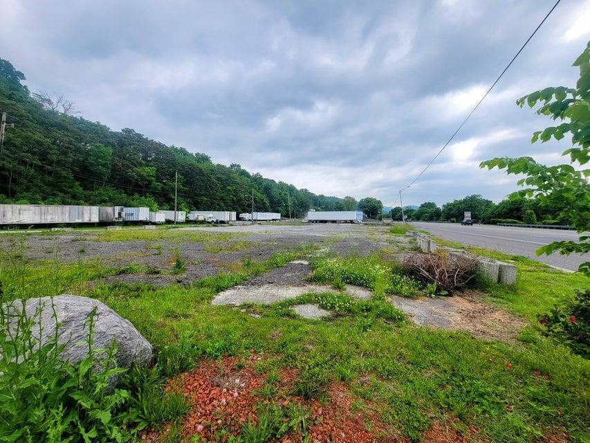 Located on a highly trafficked section of HWY 460, this .7-acre vacant land presents a lucrative opportunity for business development. With an average daily traffic count ranging between 13,000 to 15,000 over recent years, this property offers unparalleled visibility and accessibility. Property Highlights: Utilities: City water, sewer, and natural gas connections readily available. Infrastructure: Fully accessible utilities with mostly hardtop surface, providing a solid foundation for construction. Development Potential: Ideal for establishing a new business or franchise, offering a blank canvas for customization and growth. Community Demand: The local community eagerly awaits service & retail businesses, presenting a niche market opportunity in an area currently underserved.  Approximately 1 +/- acre of additional land behind the lot is available and can be negotiated.