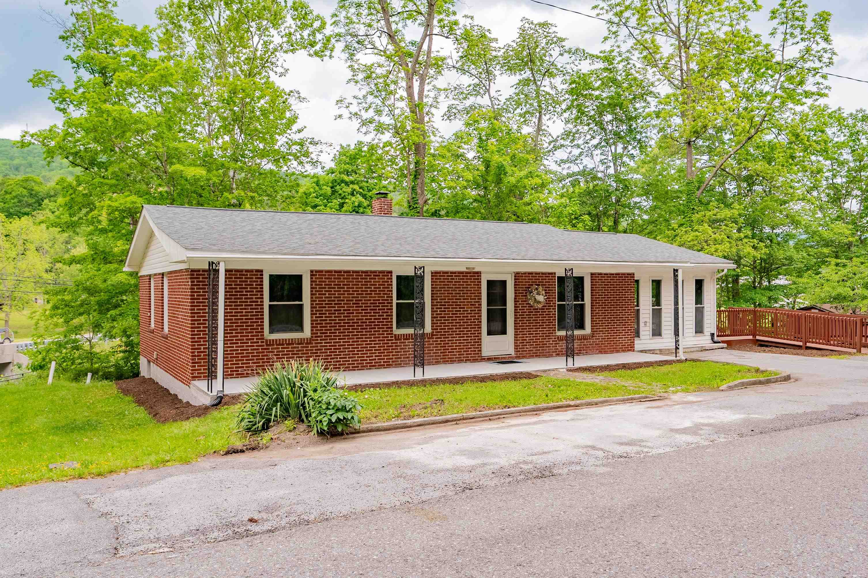 Discover this beautifully remodeled 3-bedroom, 1.5-bath home offering over 1,400 square feet of comfortable living space. From the drywall to the flooring, every detail has been thoughtfully updated to create a modern and inviting atmosphere. The kitchen features new cabinets and granite countertops, while both bathrooms have been enhanced with new vanities and toilets. Fresh paint and updated lighting fixtures throughout the home add to its contemporary charm. Step outside onto the spacious deck and take in the serene, park-like yard, complete with a charming gazebo and a versatile outbuilding. The gentle sounds of Hunting Camp Creek provide a peaceful backdrop, enhancing the property's tranquil setting. A nearby walking bridge offers convenient access to a park equipped with a playground and picnic areas, perfect for outdoor enjoyment. This move-in-ready home combines modern updates with natural beauty, making it an ideal place to live.