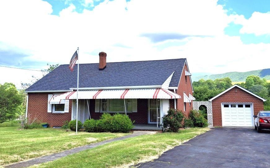 Charming Brick Ranch outside town limits!  New roof on House and Garage in 2024. Huge Living RM. Nice Kitchen. Floored Attic w/pull down stairs. Full Basement, partially finished. Great Detached Brick Garage w/double paved drive. Huge back patio. Oil Heat.