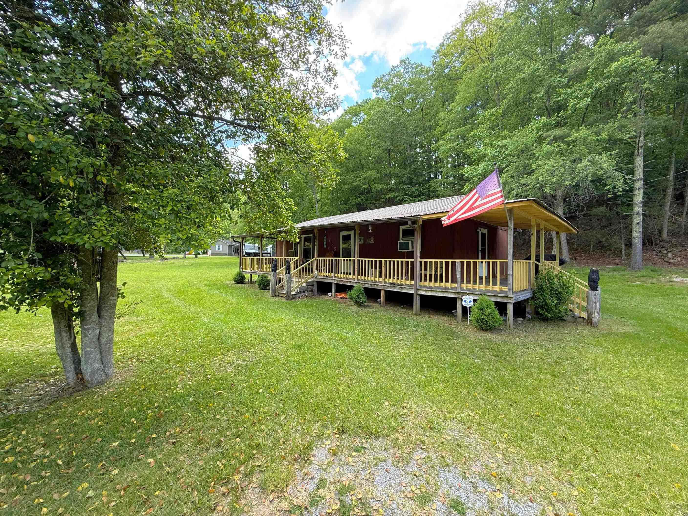 Come see this peaceful country retreat for yourself! This 2-bedroom, 1-bath home sits on 3.03 acres with an updated kitchen, newer flooring, and a roof that’s less than 2 years old. The wraparound front deck overlooks a small pond and wide open space—plenty of room to roam, relax, or explore. Take a short walk to the nearby creek for a swim or a quiet spot to fish. Located about 20 minutes from town on paved roads, this rural gem offers both seclusion and convenience. Don’t miss your chance to make it yours—schedule your showing today!