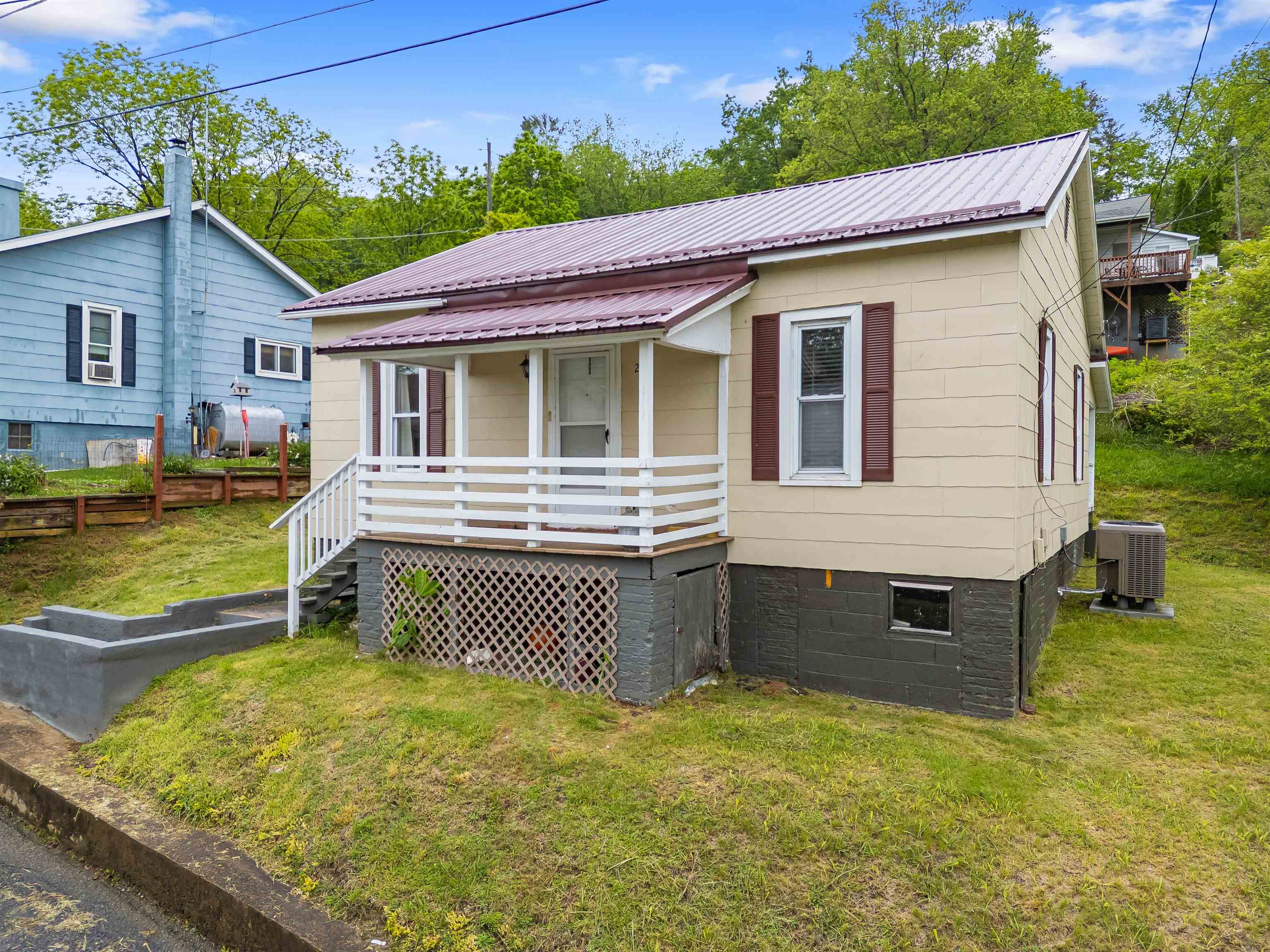 Charming 2 Bed, 1 Bath Home with River Views in Fries, VA!! Welcome to this beautifully maintained 2-bedroom, 1-bath home nestled in the heart of historic Fries, Virginia—a peaceful community along the scenic New River.  This inviting home features a remodeled bathroom, updated appliances, and a recently updated roof for peace of mind. The efficient heat pump ensures year-round comfort, while large windows fill the space with natural light and frame tranquil river views.  Whether you're seeking a cozy full-time residence, weekend getaway, or income-producing rental, this home offers charm, updates, and unbeatable access to outdoor recreation—just steps from the New River Trail, kayaking, fishing, and more.