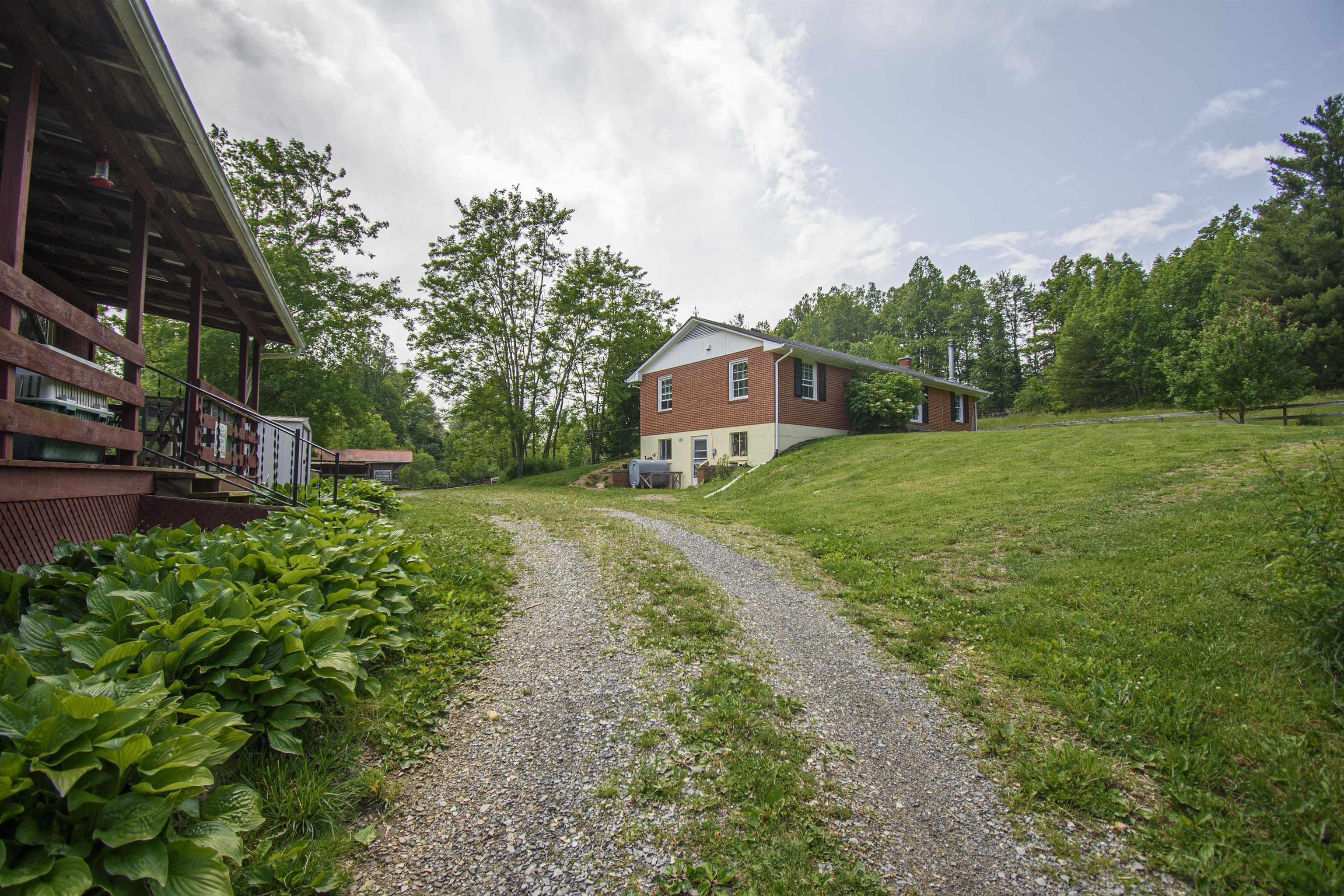 Come see this 7.5 acre organic homestead conveniently located between Floyd and Roanoke.  This active farm has been growing grains, rearing milking goats and laying hens organically since the owners purchased the property.  They have sold their fresh farmed raised eggs to local merchants for years.  The infrastructure is in place to continue operations with room for expansion.  In addition to the house, there is a separate one bedroom apartment above the horse stable.  The property is fenced and cross fenced for easy livestock management.  The chickens enjoy a large pen, coop and brood space while the goats are milked inside the barn. Several mature apple trees provide fresh fruit.  There is a spring on the property that used to supply water to the house.  The spring box and cistern are still in place.  If you are ready for escape the city and enjoy a more sustainable way of life, this is the place for you.