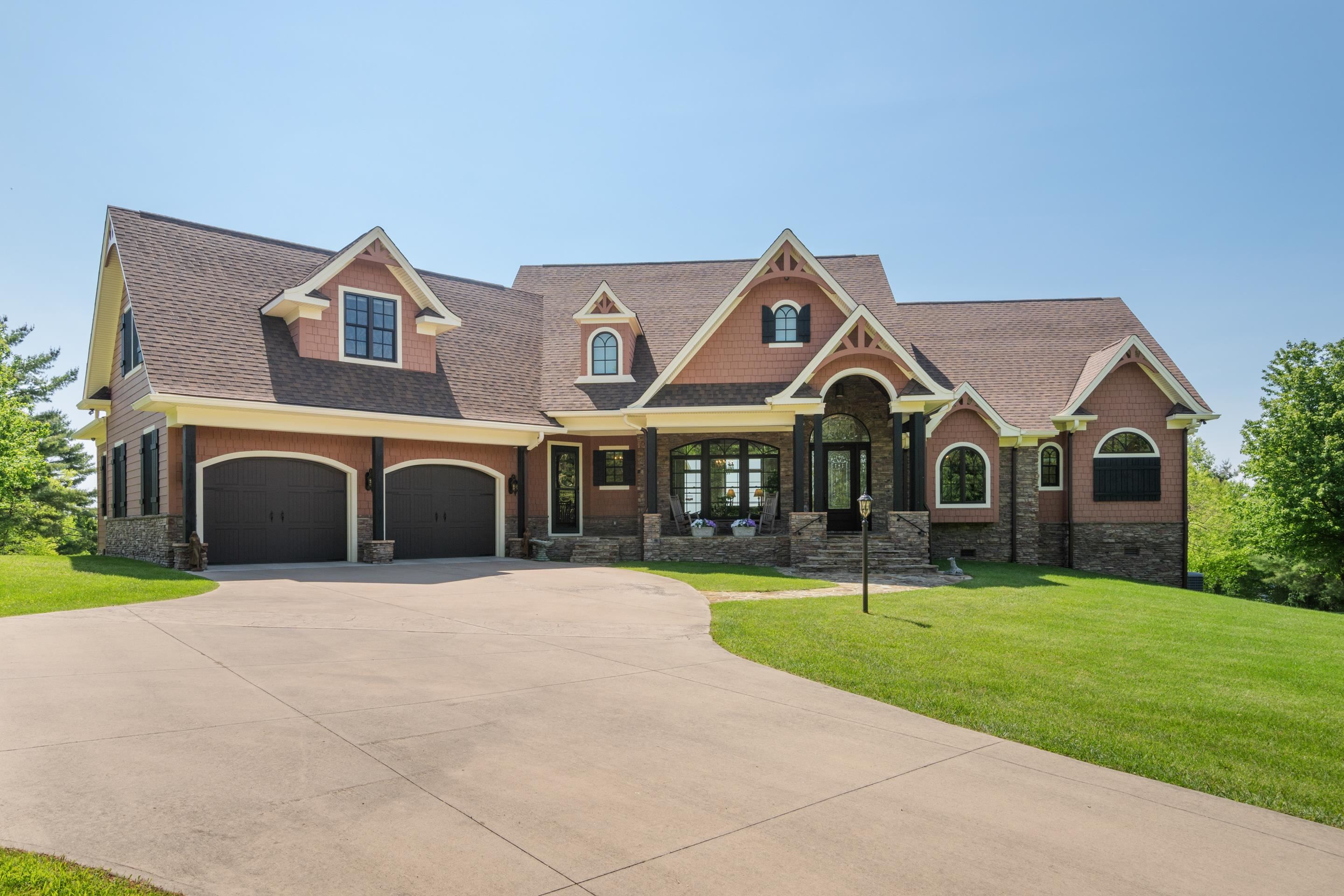 This one-of-a-kind custom home offers 4,483 sq. ft. of luxury mountain living on 12.73 acres with sweeping year-round views of the Blue Ridge Mountains and Winston-Salem skyline. Featuring 4 bedrooms, 3.5 baths, and 4 fireplaces, it boasts main-level living with a spacious primary suite, two additional bedrooms with Jack & Jill bath, private study, elegant dining room, and a chef’s kitchen with AGA stove, custom cabinetry, and open flow for entertaining. The upper-level guest suite includes a kitchenette and living space—perfect for guests or multigenerational living. Enjoy outdoor living year-round with a screened porch, covered patio, and open terrace. Professionally landscaped with pollinator-friendly perennials and mature trees. Located just minutes from Hwy 52 & I-77, this home offers serene privacy with convenient access.