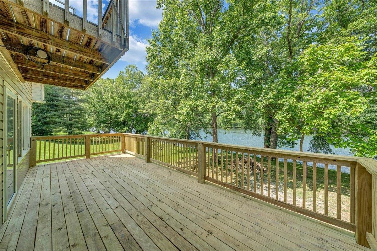 Welcome to this stunning 4-bedroom, 2-bathroom home nestled along the scenic New River. Perfectly blending modern comfort with waterfront living, this home offers direct river access—ideal for boating, kayaking, or simply enjoying the peaceful views right from your backyard. Inside, you'll find a spacious and open floor plan with stylish finishes throughout. The kitchen features and new refrigerator and ample cabinetry. Detached garage, shed, and additional carport are great for all the river toys. Step outside to a private backyard oasis with panoramic river views—your own slice of paradise. Whether you're relaxing on the patio or launching your boat for a day on the water, this home offers unlimited potential. Don't miss your chance to own this move-in-ready waterfront gem on the New River!