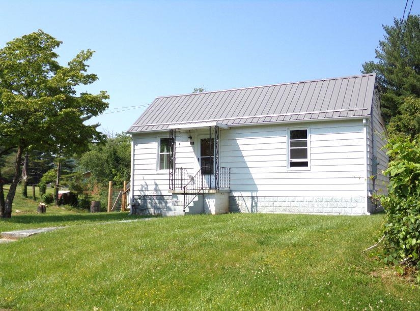 Quaint, 2 BDRM home with lots of updates!  Updates 5+/- yrs ago included new metal roof, central air, LVP flooring, insulation, electrical, plumbing, stainless appliances & more! Laundry on main w/stack washer/dryer. Detached Garage. Additional lot also available for purchase.