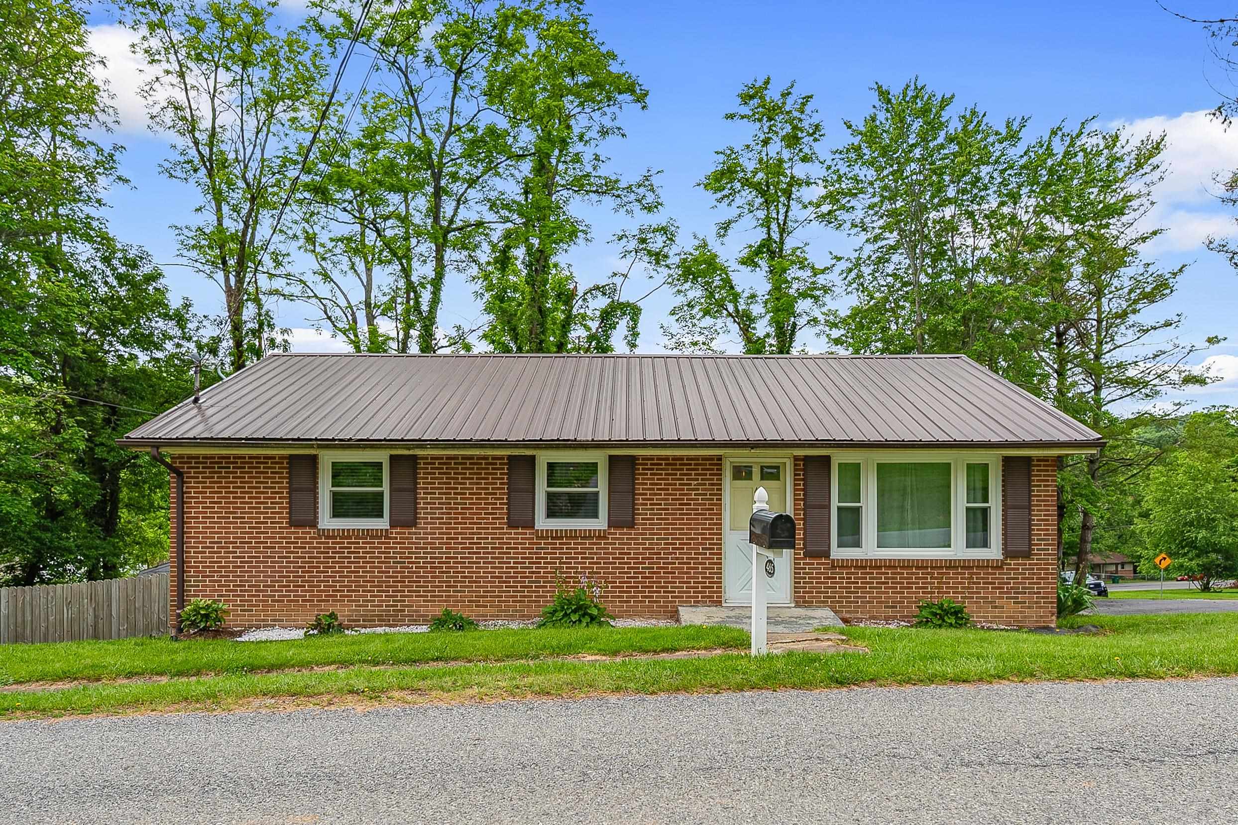 Don’t miss out on this affordable 3 bedroom, 1 bathroom home in Christiansburg. With a great corner lot, private fenced yard, and a full unfinished basement there’s plenty of space all around this property. Inside, you'll find a classic floorplan with eat-in kitchen, and all bedrooms and bathroom on the main level. Just outside the kitchen you’ll find a large open deck with stairs recently added to access the backyard. The basement, with double walkout access, is ready for expansion with a mini-split HVAC unit already in place to heat/cool the lower level. This home has been well taken care of with regular maintenance and improvements including new windows throughout the home, new door, fresh paint, and flooring. The new Huckleberry Park, Christiansburg, Blacksburg and Radford all within 10-15 minutes away. This is a great opportunity to find a move in ready brick ranch with so much value in a convenient location.