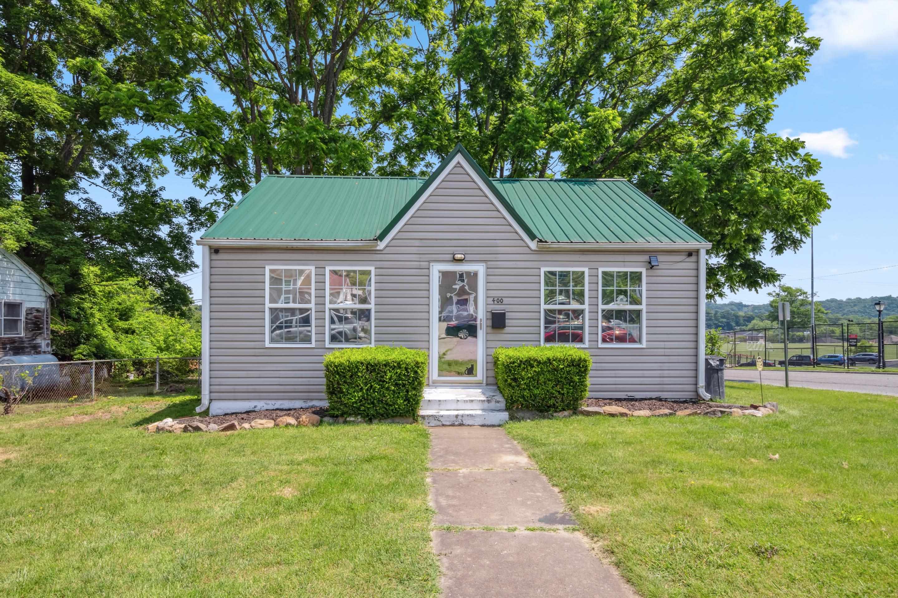 Discover this charming one-level home, perfectly situated on a corner lot in the heart of Radford. Enjoy the convenience of main-level living and a fenced backyard, ideal for pets or outdoor enjoyment. With a newer metal roof and a detached garage offering versatile use, this property is walkable to Radford University, making it an excellent starter home or a good investment opportunity!