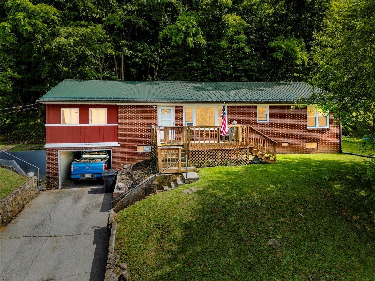 Charming 3 bedroom Brick ranch with attached garage, Family room, and spacious bedrooms all at a great price!