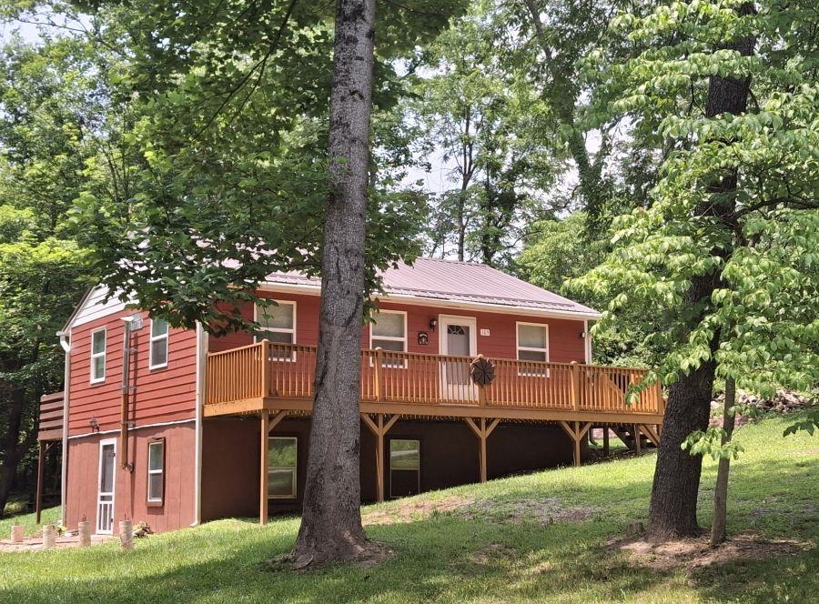 Adorable 6+/- yr old home on approx 0.52 acres. Great location outside town  limits w/easy access to RT 460. Laminate flooring. Metal Roof. Living RM. Kitchen w/refrigerator. Dining area. Laundry on main w/washer/dryer. Nice basement w/poured concrete walls & spacious Den. Relax on the front or back decks.