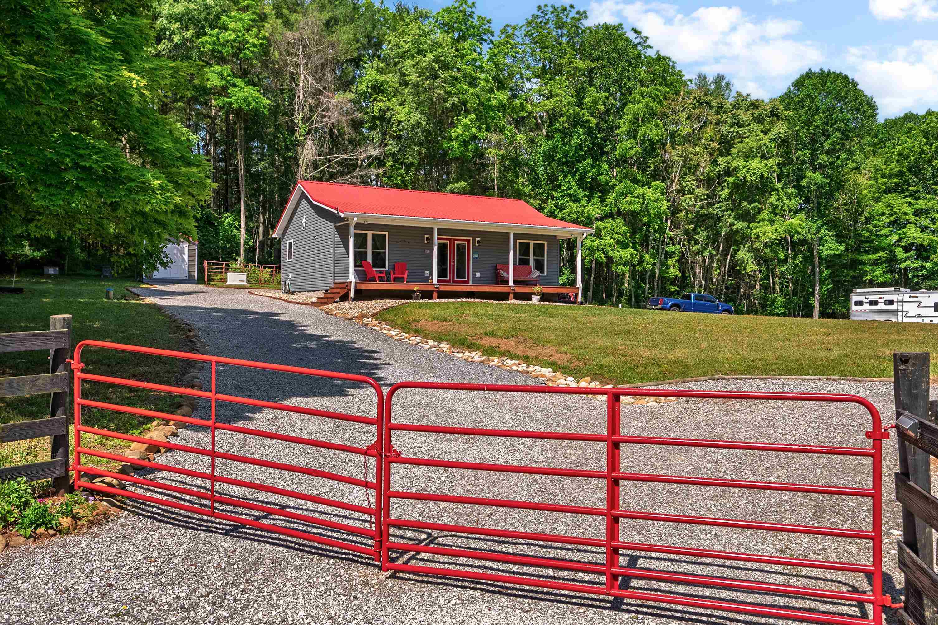 Turnkey equestrian retreat on 7.28± acres in scenic Ivanhoe, VA. Built in 2020, this 2BR/2BA home still feels brand new and comes fully furnished. Open-concept layout with stainless appliances, LVP flooring, and covered front porch overlooking fenced pasture and seasonal mountain views. Peaceful, private setting with no neighbors in sight. Fiber optic internet, underground power, whole-house generator, new storage shed, private well and septic. Horse-ready with cleared land, wraparound gravel driveway for trailers/RVs, and direct access via private trail to Cripple Creek. Minutes to New River Trail State Park and Iron Mountain Horse Camp with access to VA Highlands Horse Trail, Raven Cliff, Divide Trail, and more. Close to Hungry Horse East and Collins Cove camps. 10 minutes to New River, 20 to I-77/Fort Chiswell. Ideal for full-time living, a vacation rental, or retirement farm. A rare combination of privacy, acreage, and amenities and move in ready.