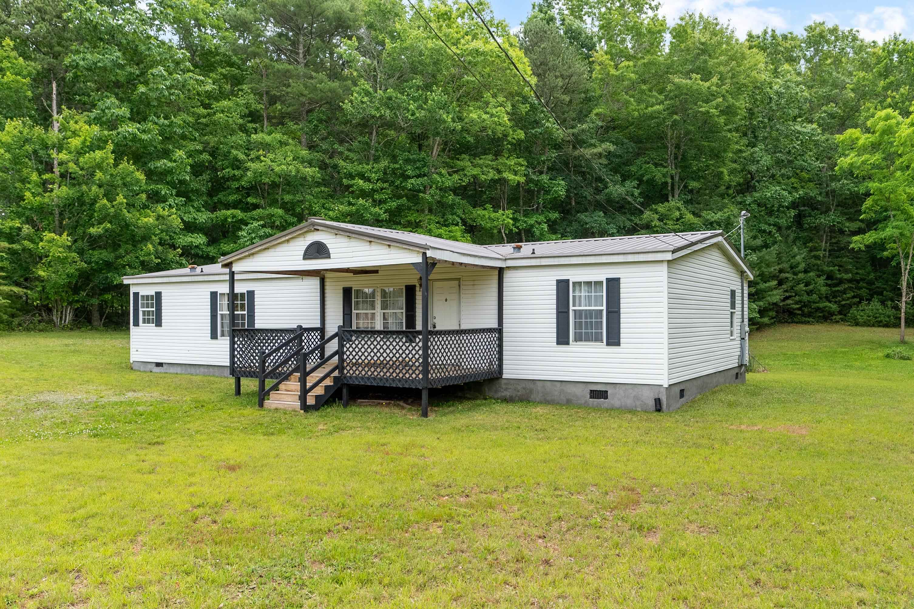 Nestled on a level lot this home is less than a half mile from the main highway and only 15 minutes from Wytheville. The spacious 3-bedroom, 2-bath home offers serene country living in the rolling hills of Virginia. Additionally, the Highland Horse Trails are just minutes away. The generous backyard provides the perfect canvas for a garden, a safe play area for children or pets, or simply peaceful outdoor enjoyment. Inside, you’ll find fresh paint and newly installed floating laminate flooring throughout—this home is truly move-in ready. Both bathrooms feature stylish custom vanities that add a touch of modern elegance and functionality. Thoughtfully crafted to appeal to buyers seeking both comfort and convenience, the home strikes a winning balance of updated features and relaxed, rural charm. Priced to sell and offered in as-is condition, it’s an inviting opportunity to settle into a tranquil setting.
