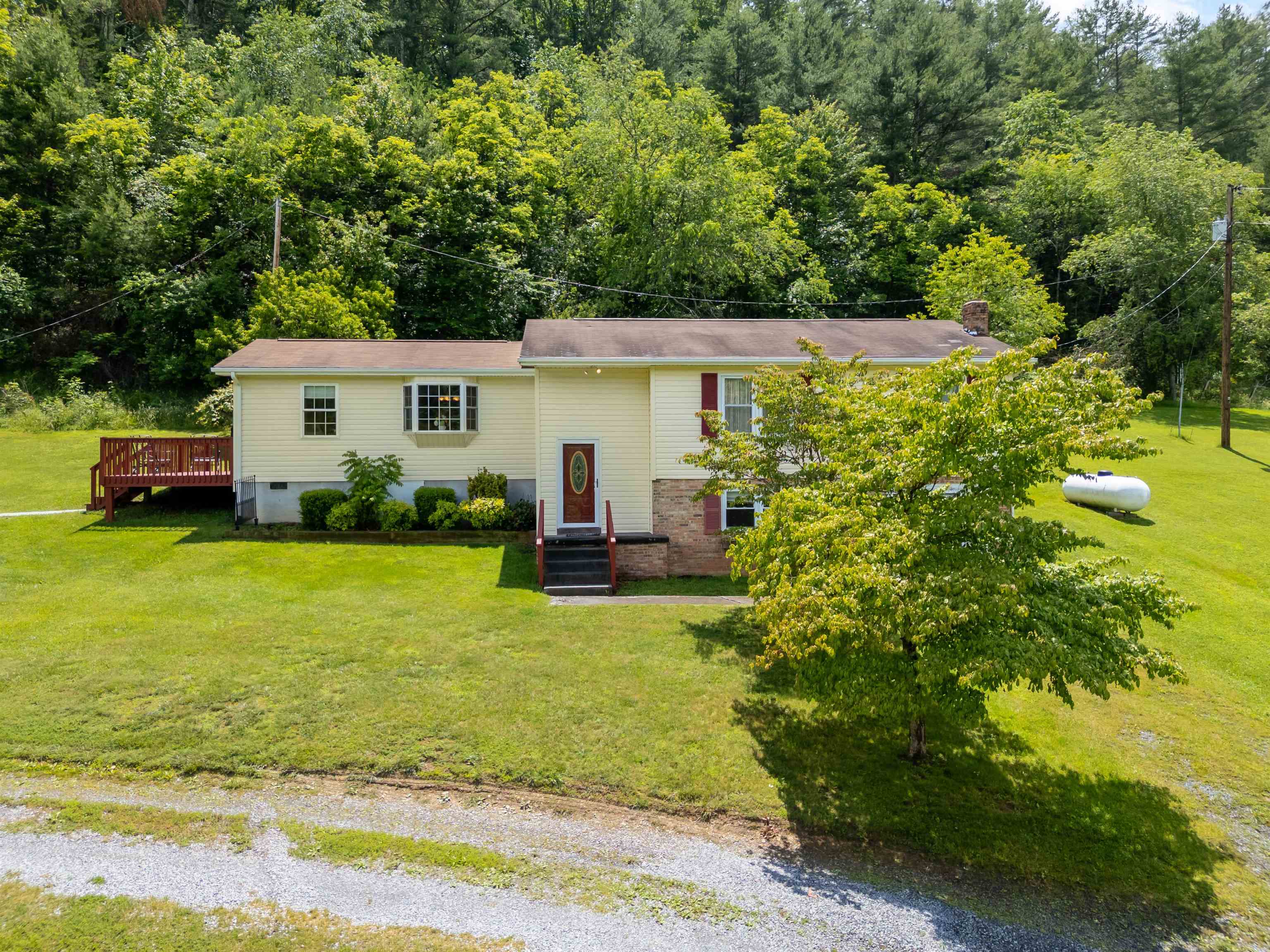 This is a beautiful home built in 1973. It has been meticulously maintained and updated with modern touches. A large state of the art Kitchen was added apx ten years ago, making it perfect for cooking and entertaining. With recent upgrades like a new HVAC system and newer siding and guttering, this property offers a great blend of classic charm and modern convenience. Basement is heated with propane. There is also a detached garage with this property. Imagine enjoying the serene views of fields across the road where you are sure to see an abundance of wildlife.
