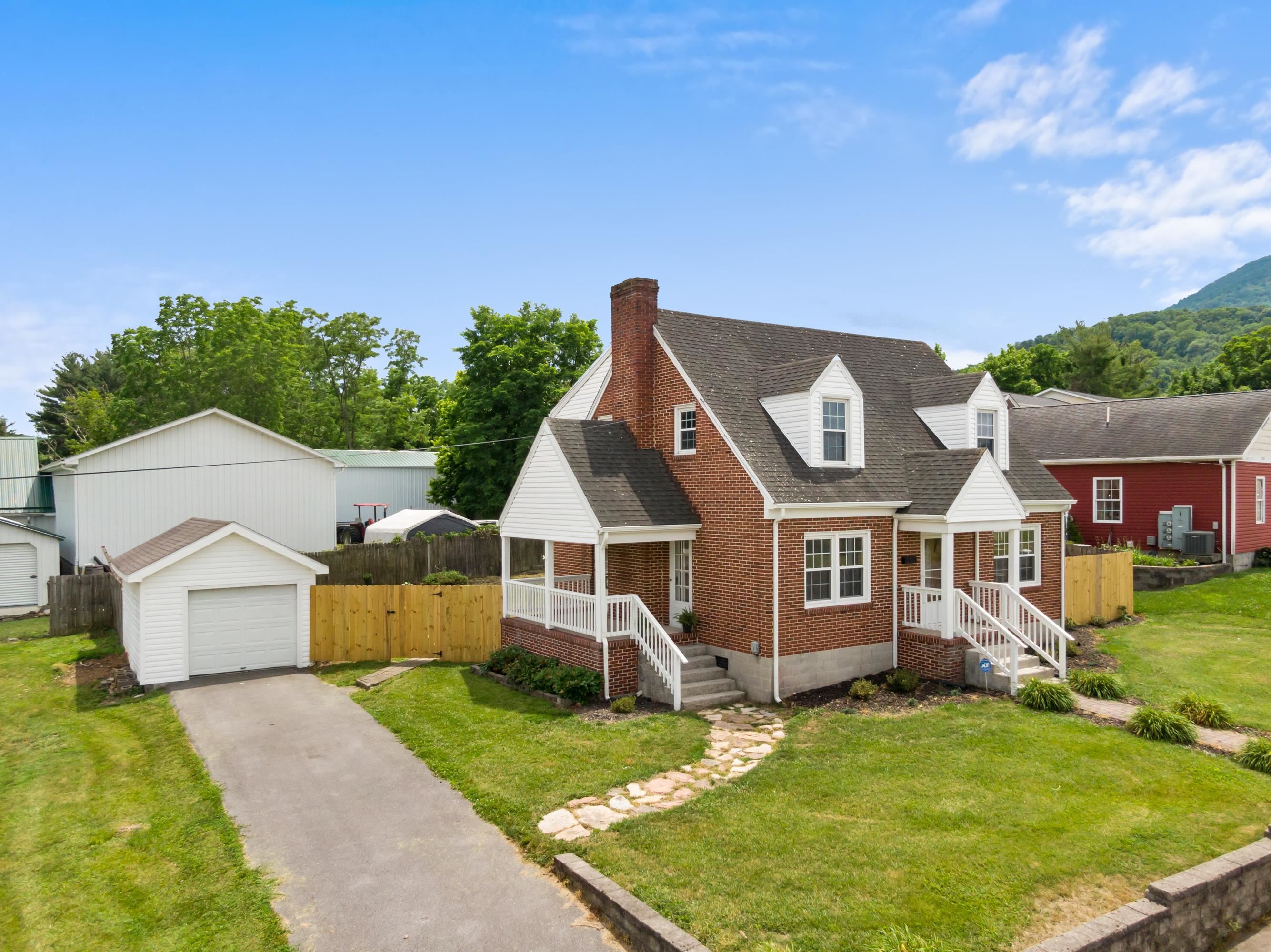 Welcome to this beautifully updated 1,688 sq. ft. Cape Cod home featuring 3 BRs 1.5 BA. Enjoy the character & thoughtful updates including a completely new kitchen & a completely renovated full bath with stylish shiplap touches on the upper level. The home boasts updated electrical & plumbing, fresh interior paint, & a den or dedicated office space-complete with an optional private entrance, perfect for remote work or a home-based business. Step outside to your private fenced yard with a cozy patio area, a water feature & new fencing - ideal for pets, relaxing or entertaining. Additional highlights include a heat pump and natural gas service and a detached single-car garage with electricity. Movin-in ready and full of charm, this home is a must-see!!