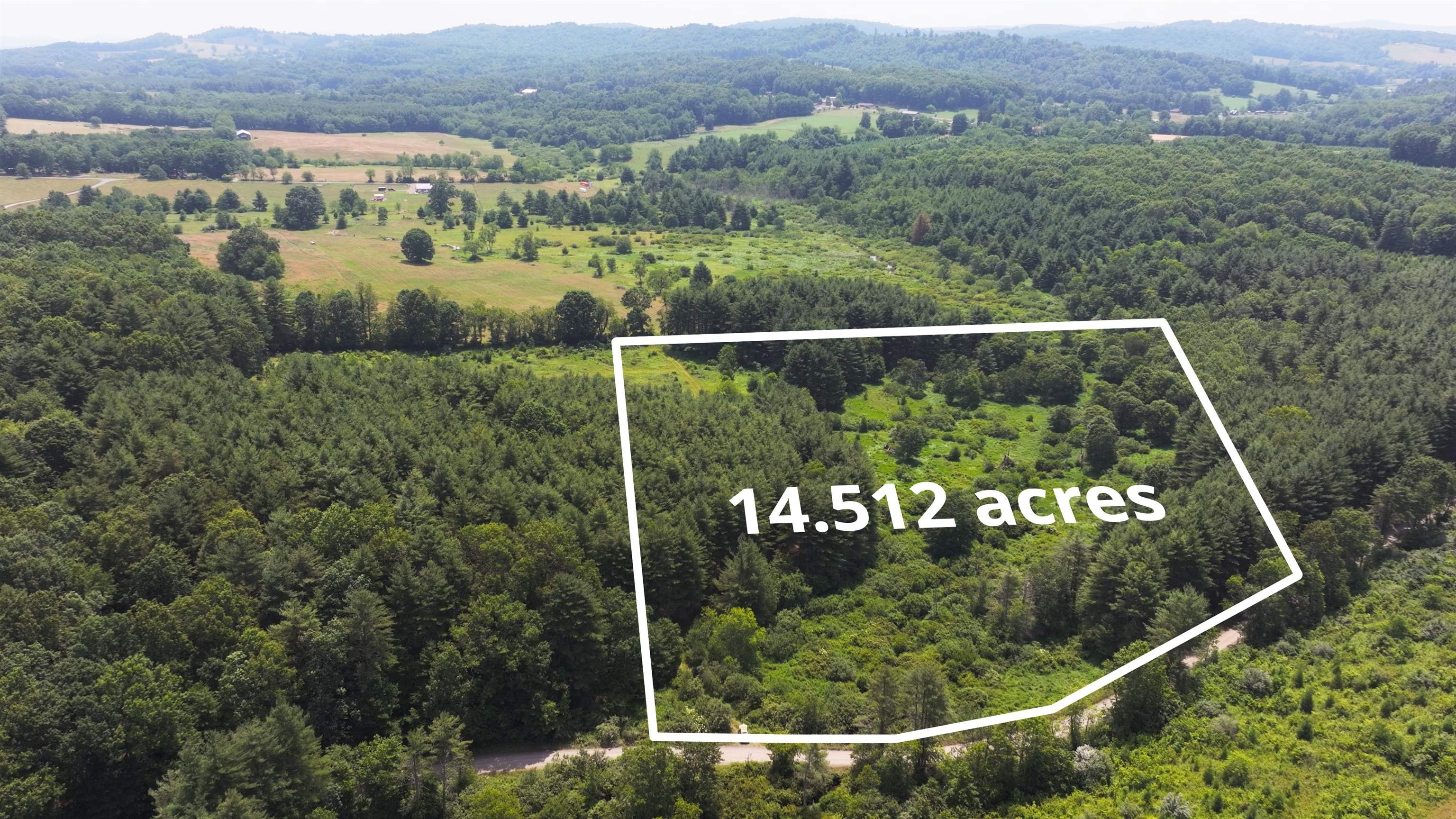 With over 14 acres of woods and semi-open area, this property has many possibilities.  The North Fork of Greasy Creek meanders through the property and there is already a nice acces road in place.  The property has already been perked for a three bedroom home.  Within 20 minutes of the town of Floyd, this property offers privacy and convenience.  High speed fiber optice internet is available.  If you desire more land, there are adjoining parcels for sale.  Be sure and check out the video by clicking on the Virtual Tour link.
