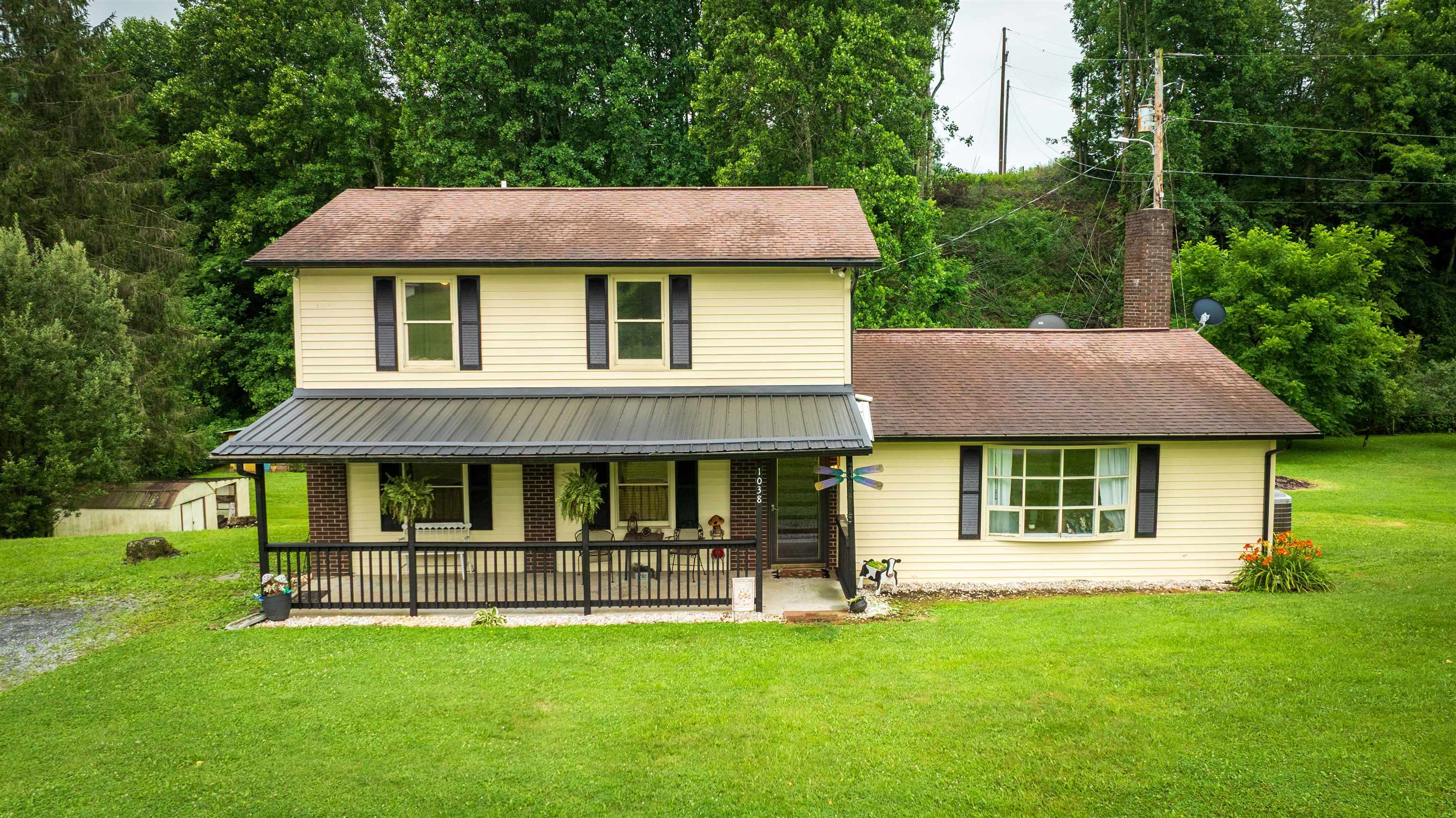 Escape the hustle and embrace the tranquility of country living in this well maintained 3-bedroom, 2-bathroom home sitting on just under an acre.The primary suite is conveniently located on the main level, along with the laundry room. Two additional bedrooms upstairs provide space for family, guests, or a home office.Step outside to enjoy the sounds of the backyard creek and a sprawling yard dotted with mature fruit trees to include: apple, pear, cherry, and plum. The home has several updates such as: new paint inside and out, new gutters, new porch roof, new hot water heater, new pressure tank, new roof for the chicken coop, new dishwasher & stove, new building on the deck for storage and more! Whether you're looking to simplify or raise a family in the fresh country air, this property provides room to grow, breathe, and live the lifestyle you’ve always wanted.