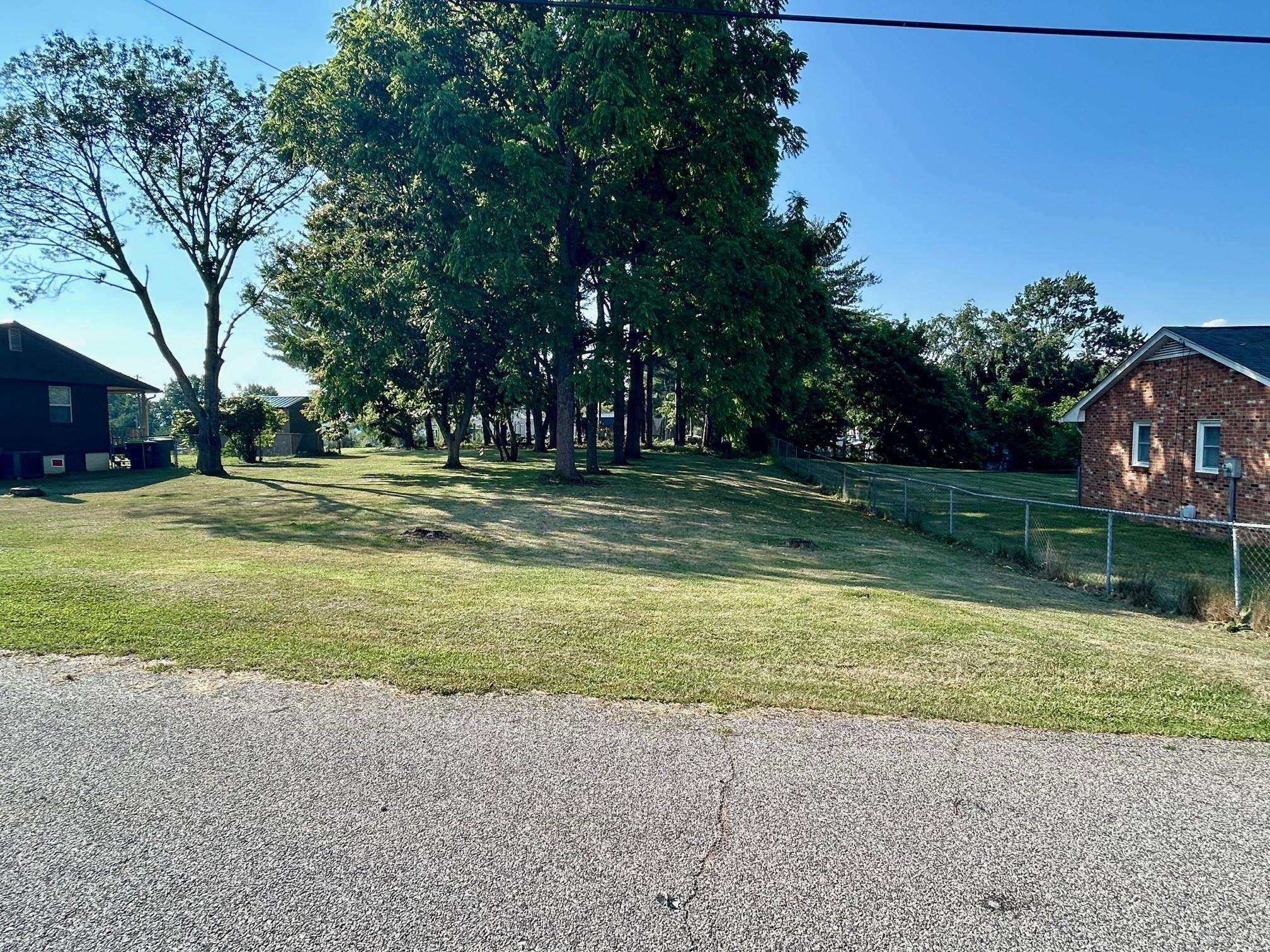 FLAT 0.5165 Acre RESIDENTIAL BUILDING LOT in the Town of Christiansburg.  Close to Rt 460, Rt 460 Business, I 81, Rt 114, and Rt 11. Public Utilities available. Easy access to all points in the NRV.  L- Shaped lot with 75" of frontage on Boxwood Dr and 100' on Redwood Dr. with some mature trees. Zoned Commercial/B3 BUT owner has obtained a Conditional Use Permit to allow a Single Family or Two Family Dwelling. DW allowed (no single wides.) See Documents.