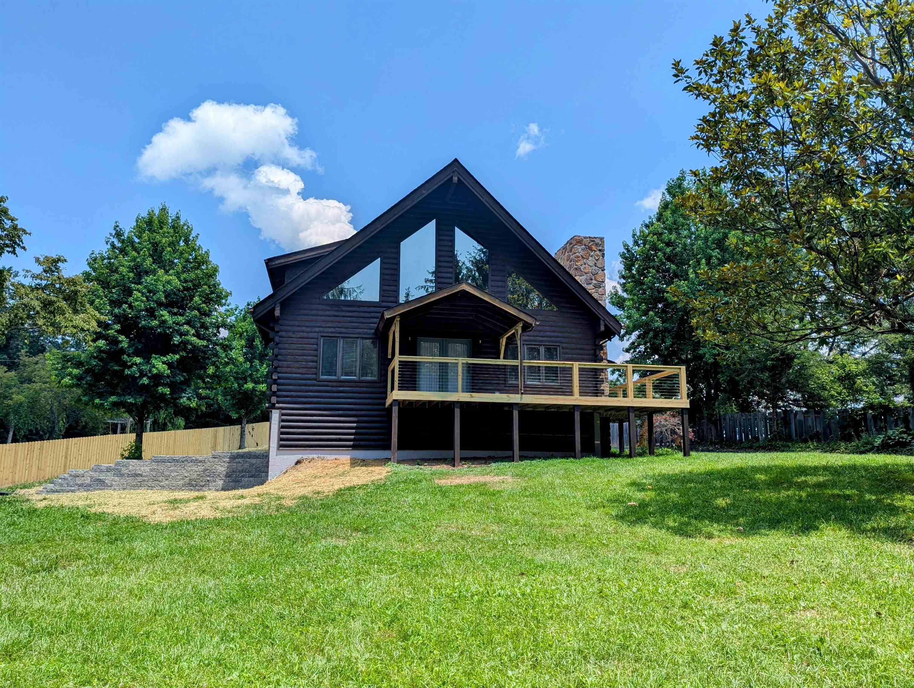 Log home with recent upgrades for sale in Riner VA!  This property sits in Floyd County VA but offers a Riner VA address, providing a short drive to the New River Valley area while experiencing the lower real estate tax rates of Floyd County!  2 BDR, 3 BTH, boasting over 2,000 sq ft of living space this home has recently been updated from the basement to the loft.  Kitchen upgrades and bath improvements compliment this home very well.  Beautiful heartwood pine floors are found in the main level bedroom. During the cooler months take advantage of the wood burning fireplace in the living room. The home is also served by a heat pump system for both heating and cooling on all floor levels. The exterior of the home has been recoated in recent years with new stain, a new front porch constructed and the walkout basement has been improved.  The asphalt drive has been resealed and a storage shed sits behind the home for your convenience.  Schedule your visit to view this property!