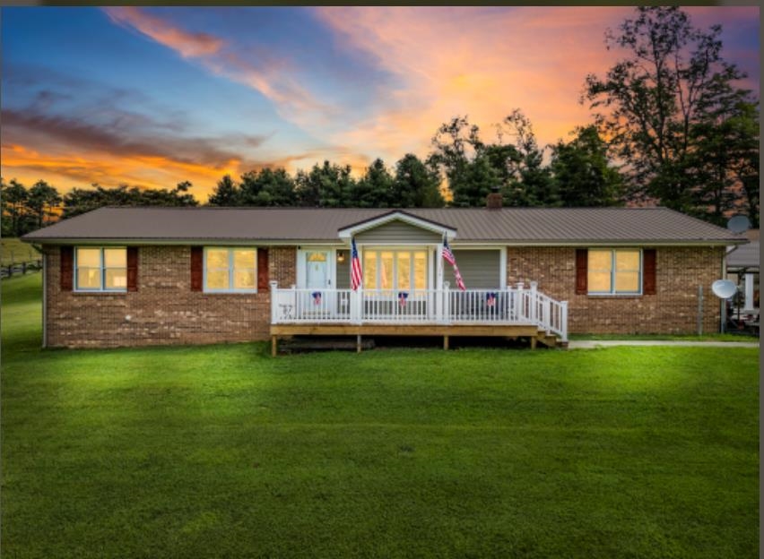 Beautiful 4 Bedroom 3 Bath Brick Ranch Home on 2 Acres  in Floyd. This Home was Built in 1996 and has Been updated recently. The Home Offers a Open Living Room, Kitchen, Dining Room with a Upgraded Kitchen with Granite Counter Tops. Newer Appliances. The Main Level offers 3 Bedrooms and 2 Full Baths.  The Main level has new Luxury Vinyl Flooring Throughout. There is a 350 Feet Sunroom attached off of the Living room with a New Mini Split. The Whole house has a New Heat Pump. There is an attached 2 Car garage with a Mini split. Downstairs you have a Bedroom with a Full Bath in it and an office and a Huge Living Room. There is also a Wood Stove Downstairs. The Home has a Newly finished Covered Front porch and a 2 Car Carport. There is also an Attached 2 Car and detached 2 Car Garage with a covered Patio area off of the Garage. The detached Garage also has a Mini Split.  The Driveway is paved. The property comes with several out buildings. The Yard lays great with tons of Landscaping.