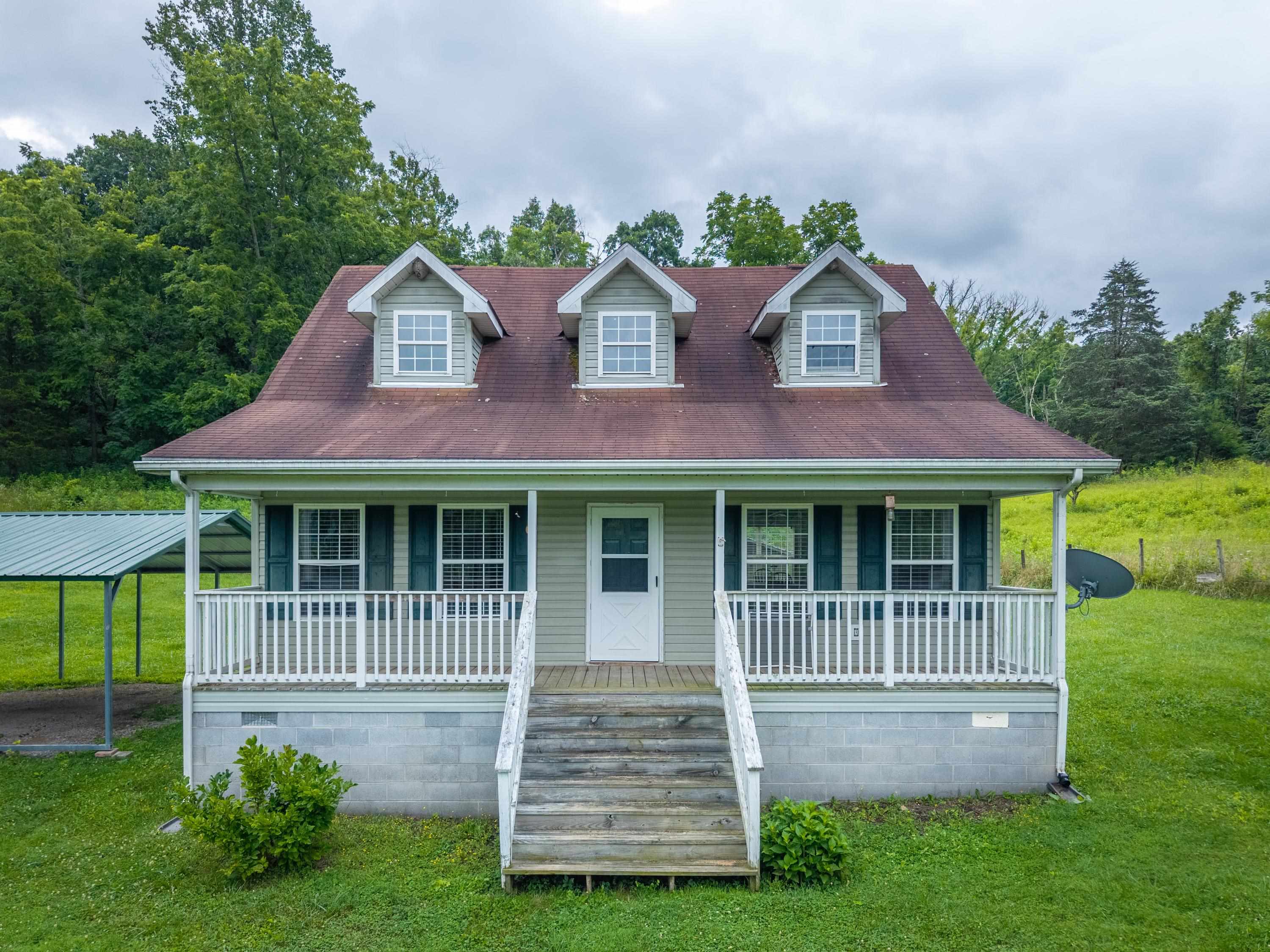 Welcome to your slice of country paradise! This charming 3-bedroom, 2-bath home sits on approximately 12 gorgeous acres just outside the town limits of Narrows. Enjoy the peace and privacy of rural living with the convenience of town only minutes away. Relax on the huge front porch and take in the scenic views of rolling hills, open fields, and mature trees. Whether you're looking for space to garden, explore, or simply unwind, this property offers endless possibilities. A rare find in a stunning location—don’t miss your chance to make it yours!  When Using GPS please enter the address 122 TOTSIES MTN DR