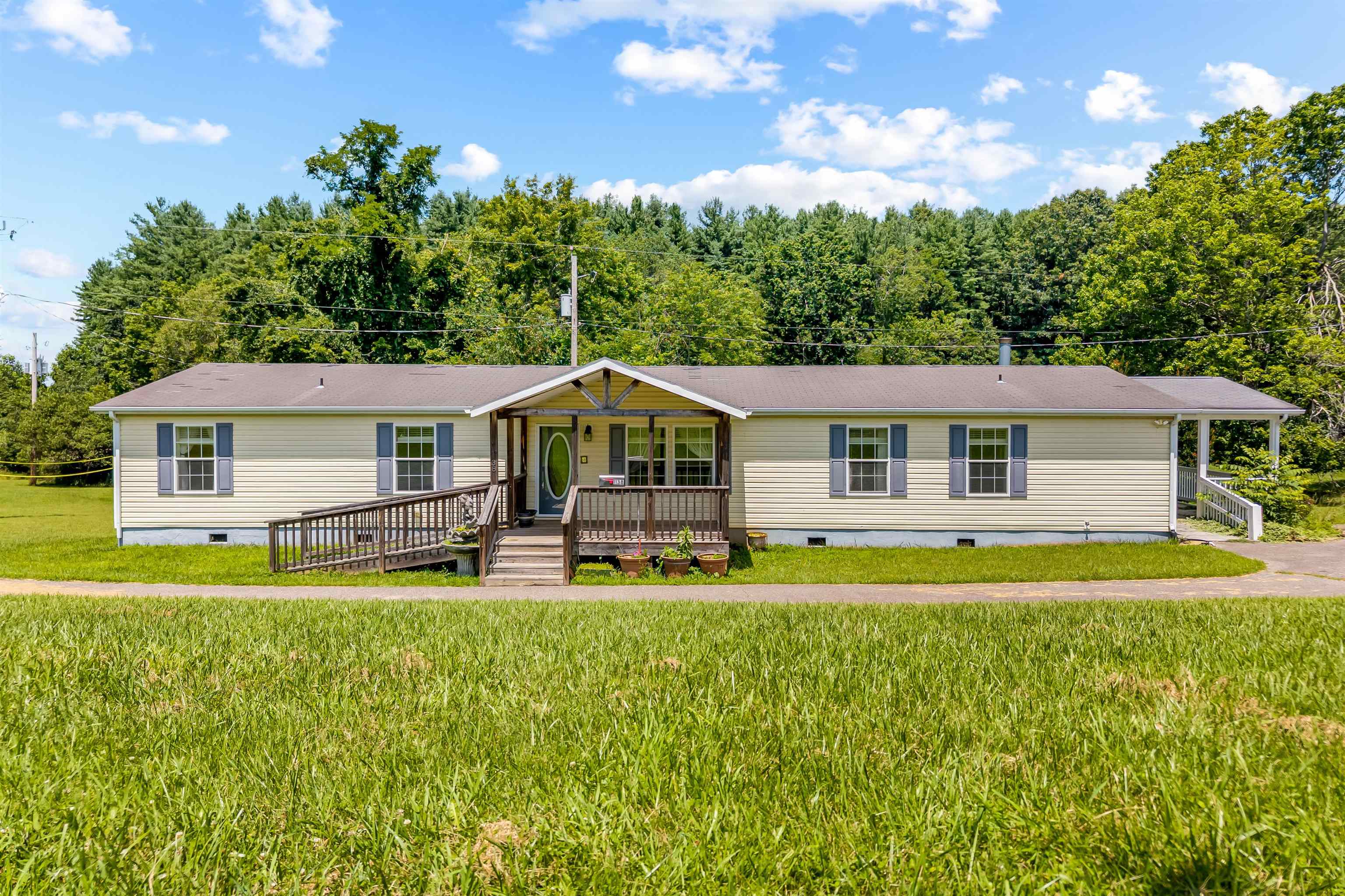 Spacious, one-level, 4 bedroom, 3 bath Modular home with open floor plan. Hardwood laminate flooring throughout. Large walk-in kitchen pantry. Heat pump less than 1 year old. Very energy efficient home. Two covered decks with handicap ramps. Conveniently located 2 miles from Town of Floyd and 3 miles to Blue Ridge Parkway. Great neighborhood. Paved drive with storage shed and covered carport.