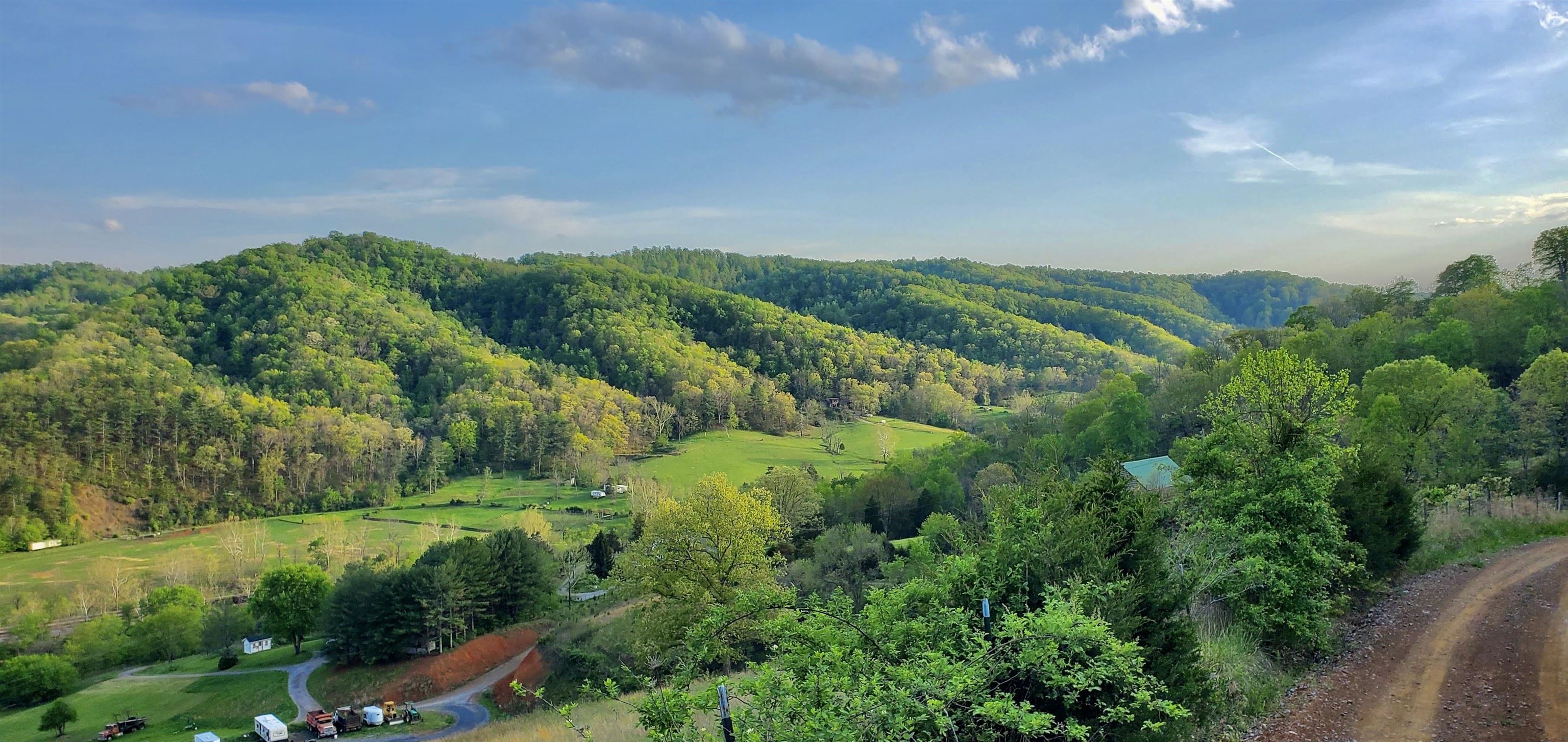 This beautiful mountain property includes 2 adjoining lots overlooking the majestic valley below. Offering 16 acres of unrestricted land mere minutes from Downtown Blacksburg and Downtown Christiansburg. Centrally located between the NRV and the Roanoke Valley, this mountain retreat would be the perfect place to create a private vacation destination, a full-time homestead, or enjoy for recreational and hunting purposes. Long-range views, the old growth forest, the abundance of wildlife, along with the convenience and proximity to town make this an ideal property for recreation or private living. Improvements include several rough-in roads and leveled building site, a cinderblock garage shell, and what looks to be the start of a dwelling which was never completed. Much of the expensive excavation work has been done making this land ready for a new owner to begin making it their own right away. Grab your slice of paradise while you still can!