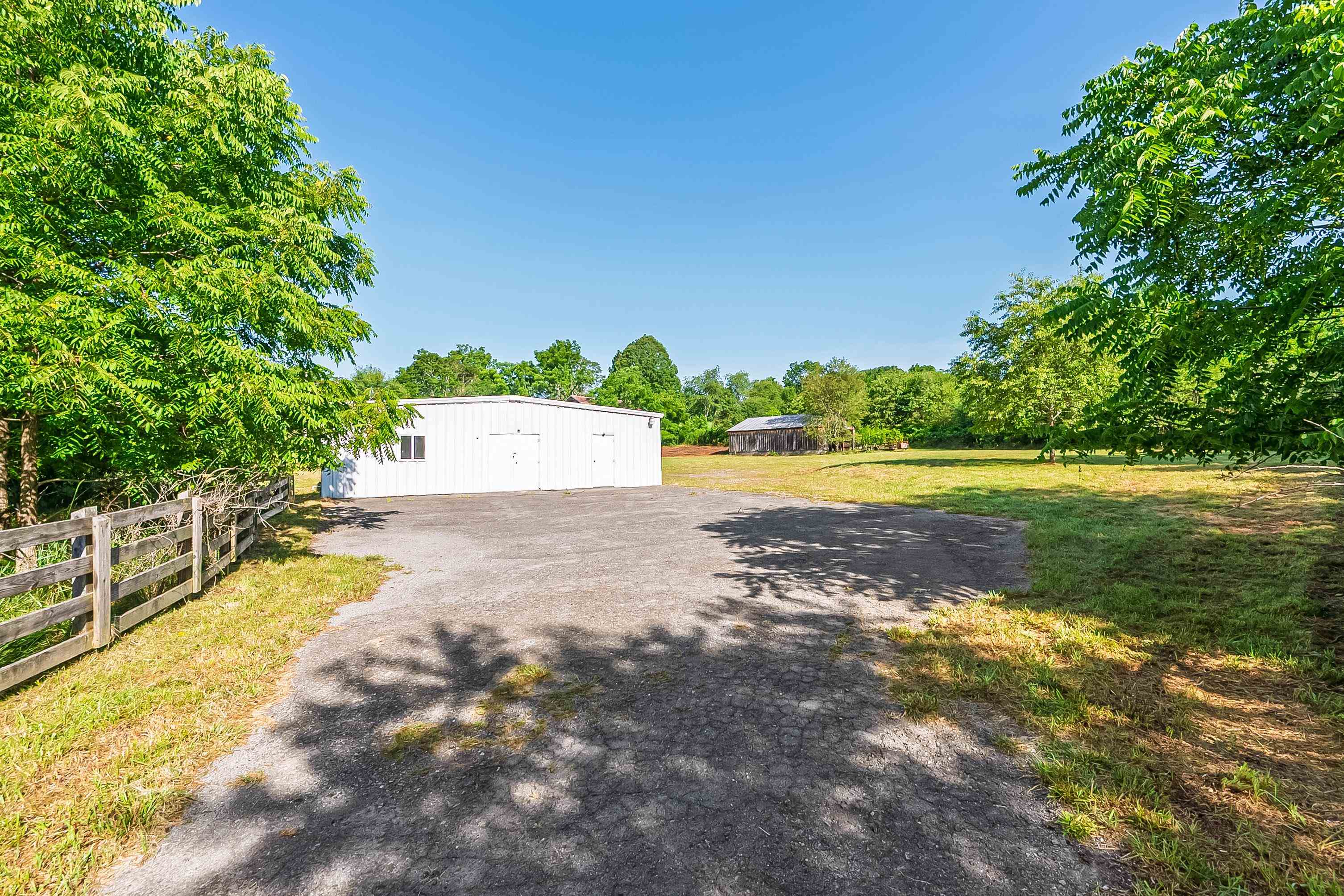 Great property with loads of potential close to I-77 in Bland, VA. This steel building structure has a total of approx. 2600 sq ft with approx. 1000 sq ft of it that has been finished at one time for residential use. There are two bedrooms, two half baths that could be combined to one large bath if desired, a large kitchen and more. Currently the building is in need of TLC to get it back up to par but there is already a well and septic in place as well as an outbuilding and shed. There is no working heating or cooling at this time, or a water heater, so again TLC will be needed, but this is a good opportunity for someone with their own local business. Paved parking area with plenty of room and approx. 3 acres of land. Plat on file. Property being sold as is.