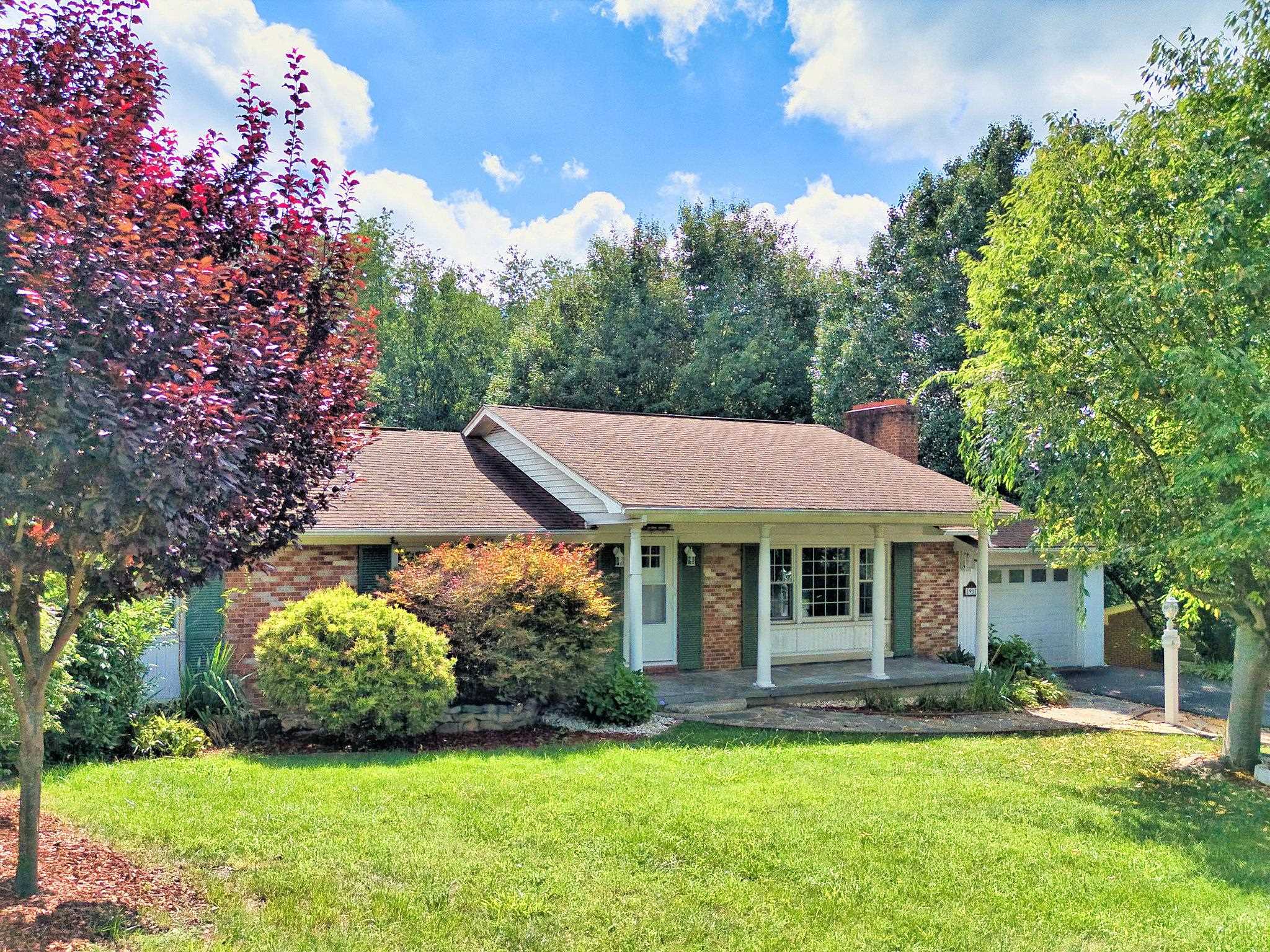 This delightful four bedroom, three full bath, brick ranch home with a covered front porch, has an updated kitchen, primary bathroom, new paint, new flooring and an attached garage plus a full walk out basement and is in move-in condition!  Exposed beams in the living room, main level Primary Bedroom Suite with a large second bedroom (originally 2 bedrooms with wall removed) plus an additional bedroom/office (no closet), and a 2nd lower level Primary Bedroom Suite (no closet) with a Primary Bathroom.  There is additional living space in the large Family Room in the walk out basement plus additional storage with a nice back yard! Located minutes to Calfee Park and I-81. Call for your private showing today!