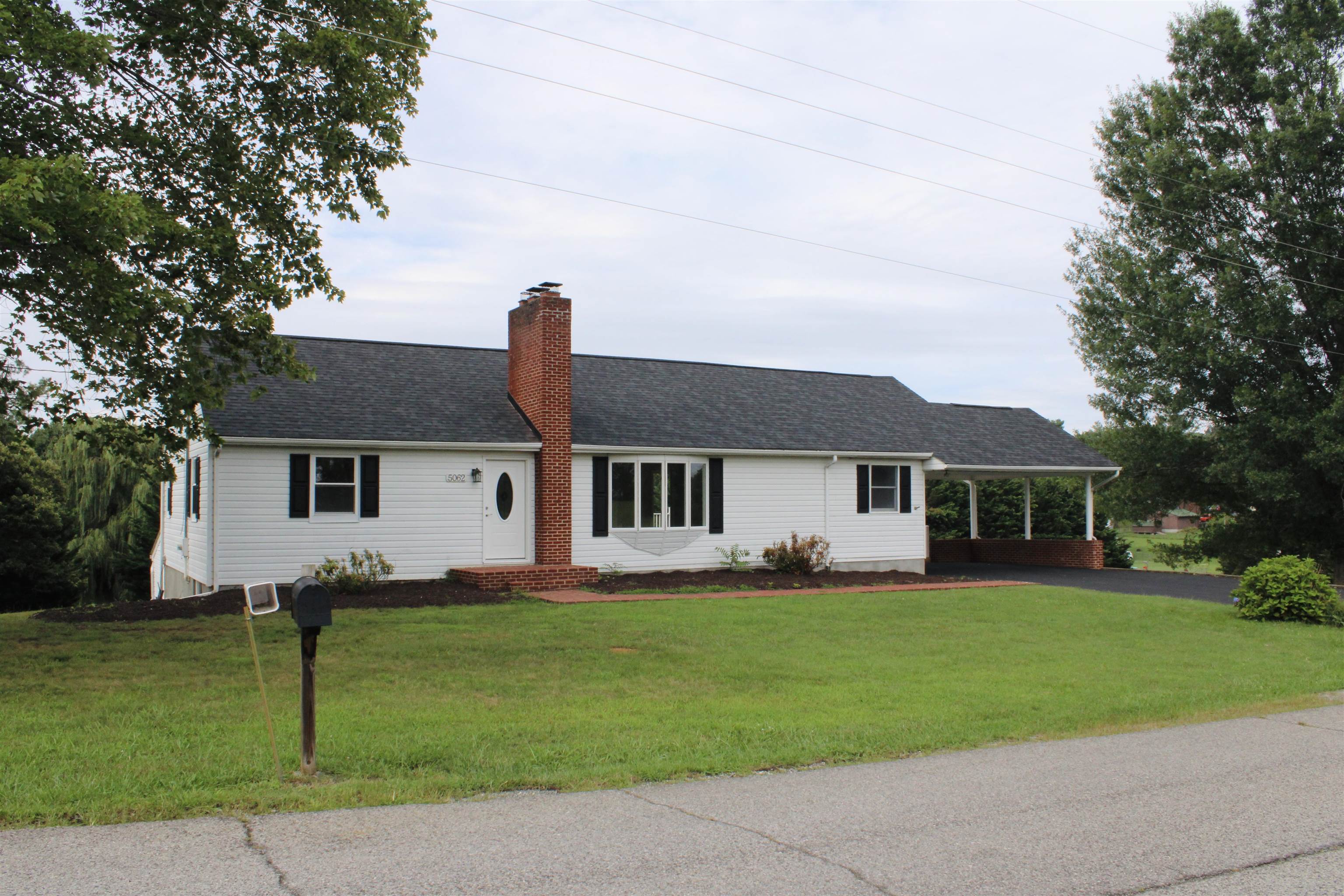 Welcome home! Come check out this spacious ranch style home right in the heart of Dublin. This house has lots of new updates such as new roof, new back porch, can lights throughout the house. Some of the key features of this space are the beautiful hard wood floors, tiled kitchen and baths, tongue and grove paneling that adds a rustic touch. Large living room with a newly tiled fireplace. Outside there is a covered carport and a detached building, perfect for an outdoor shop or just extra storage. Location of house puts you seconds away from most everything in the Town of Dublin; Walmart, I-81, fast food restaurants, etc.