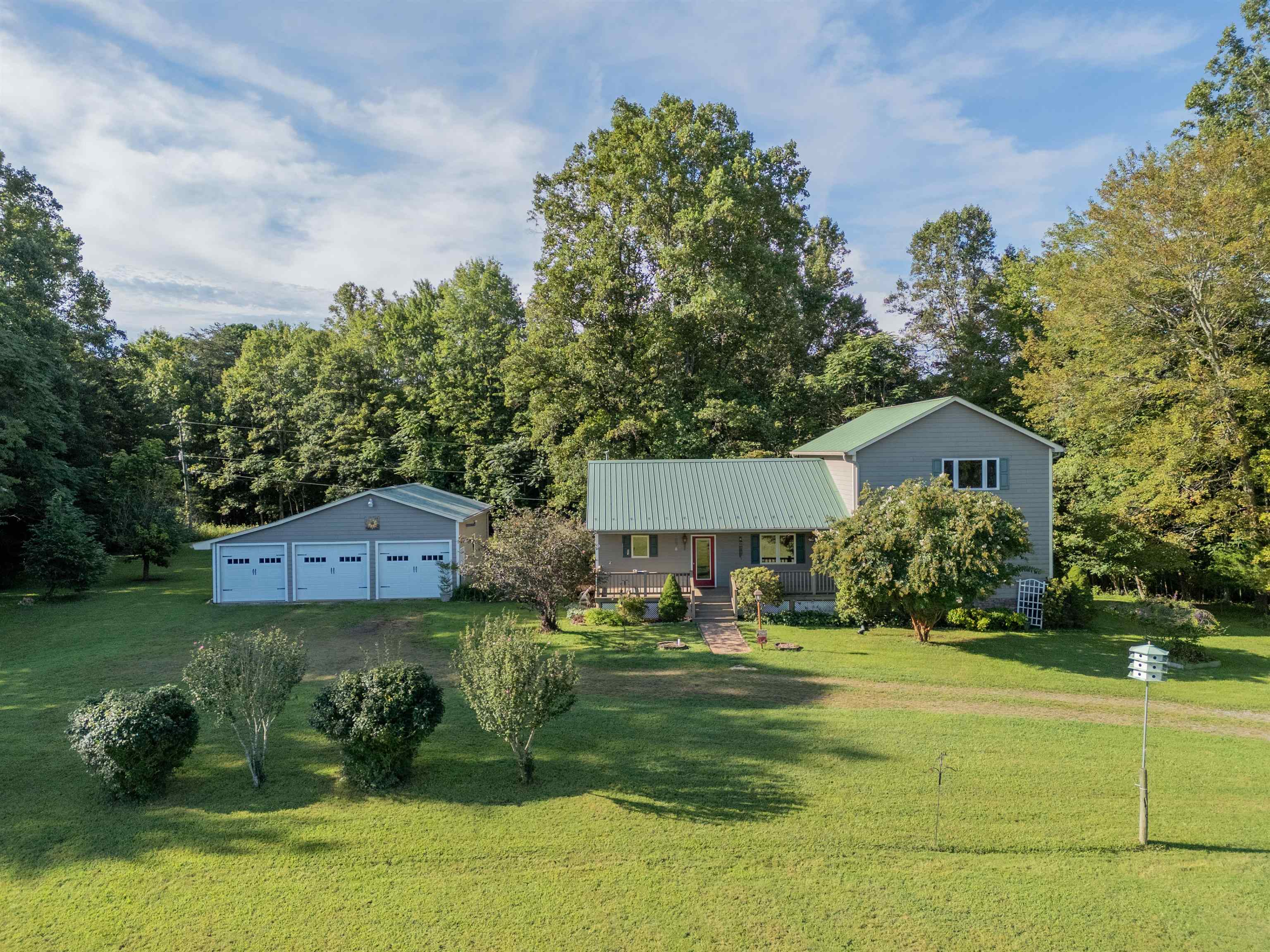 Nestled on 10+ picturesque mostly level acres, this serene property offers a blend of rural charm and modern convenience. Enjoy winter views of Bull and No Business Mountains from your front porch. This custom built, well-maintained home features 3+ beds & 2 baths. The large primary suite offers spectacular mountain views. The large covered back porch provides additional living space and opens onto a fully fenced back yard. A whole house generator ensures you are not without power.  The exterior boasts quality Hardie plank siding, composite decking and a metal roof. The spacious detached garage has room for vehicles, equipment and workshop space. With level open pastures, mature trees, room for gardens and livestock, this property is ideal for hobby farming, homesteading, or simply enjoying peaceful country living. Just 10min to Stuart, 20min to Martinsville & 1hr to Winston Salem or Greensboro , enjoy privacy, nature, and a slower pace of life without sacrificing accessibility.