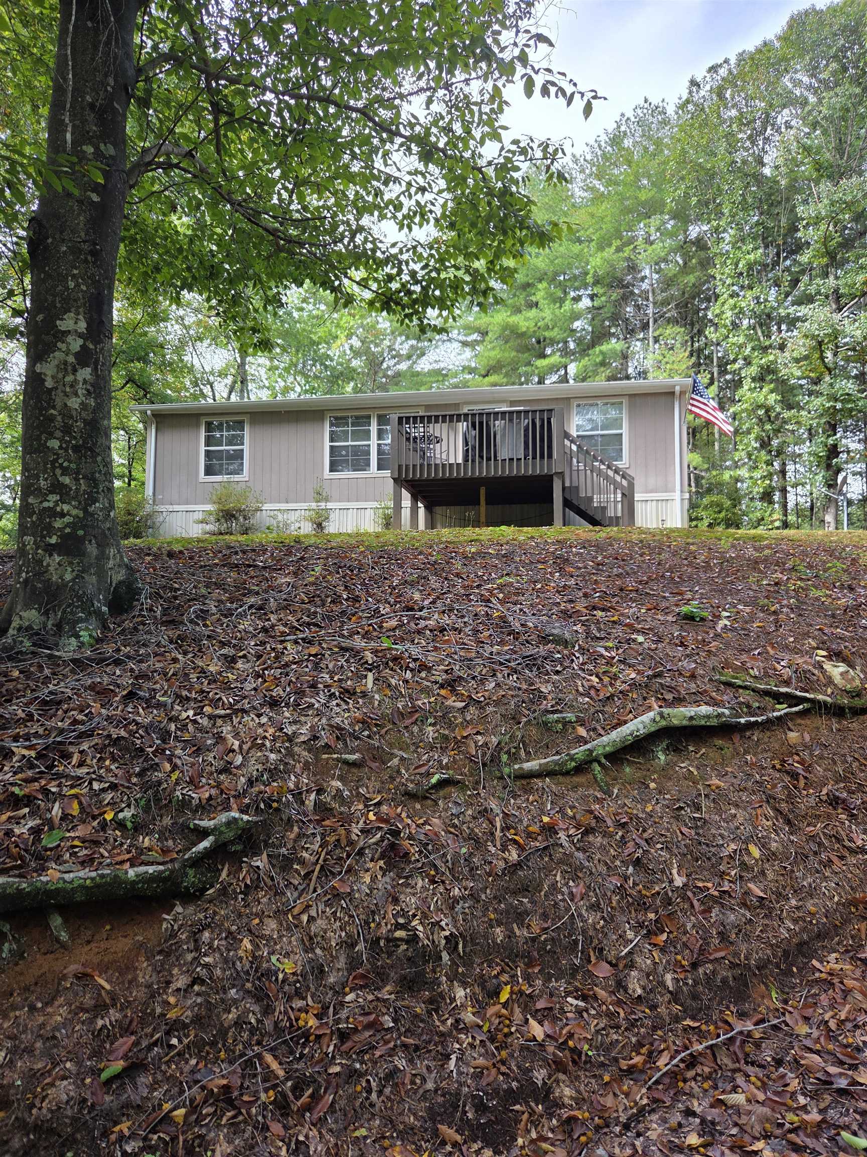 Come see this meticulously maintained home on a private one acre parcel. Owner has done many upgrades to the property and the home is in excellent condition. All appliances are in working order and convey with sale. The home is on a permanent foundation with current engineering report. Some improvements include having hazardous trees removed, improving driveway, adding a sidewalk, gutter guards, and ceiling fans. Routine pest treatment for prevention has also been kept up. This would make a perfect home for anyone who values their privacy and enjoys being surrounded by nature. Having 3 beds and 2 bath allows ample room and the large storage building is great for  overflow. Schedule now for your private showing.