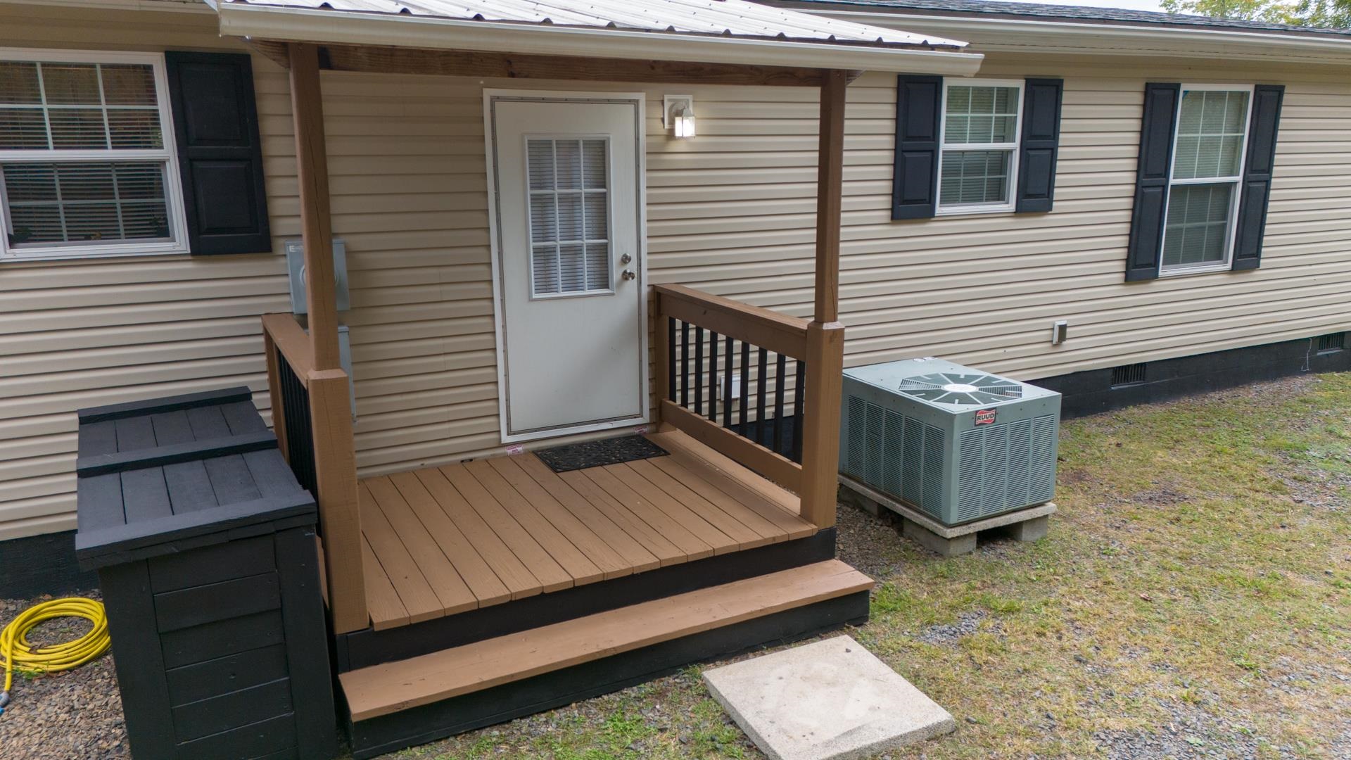 Discover mountain living at 631 Blue Ridge School Rd in the charming Fancy Gap! This beautifully maintained home offers a new roof, covered back deck, and new well pressure tank, ensuring comfort and peace of mind. Relax by the cozy wood-burning fireplace or take in stunning mountain views from your backyard. Nestled on a quiet road just half a mile from the Blue Ridge Parkway, this serene retreat is perfect for a small family or an Airbnb getaway. Enjoy modern updates, rustic warmth, and the natural beauty of the Blue Ridge all in one!