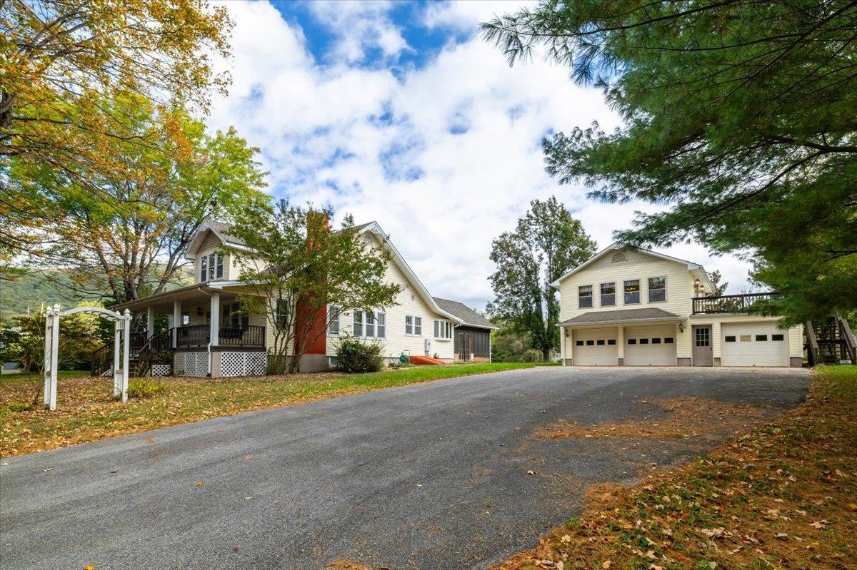 Don’t miss this charming gem tucked away on nearly 4 private acres! The main home has been beautifully updated, blending modern comforts with timeless character. You’ll love the spacious, fully updated kitchen featuring sleek, modern finishes, the gorgeous hardwood floors throughout, and the warm charm of the original trim that showcases this home’s 100-year-old craftsmanship. Enjoy peaceful evenings on the screened-in porch complete with a hot tub and plenty of space to relax. The detached three-car garage offers ample storage and includes a 1-bedroom, 1 bath loft apartment with a full kitchen—previously used as an Airbnb (approx. 525 sq. ft.). Conveniently located just 25 minutes from Blacksburg. This one won’t last long—schedule your showing today!