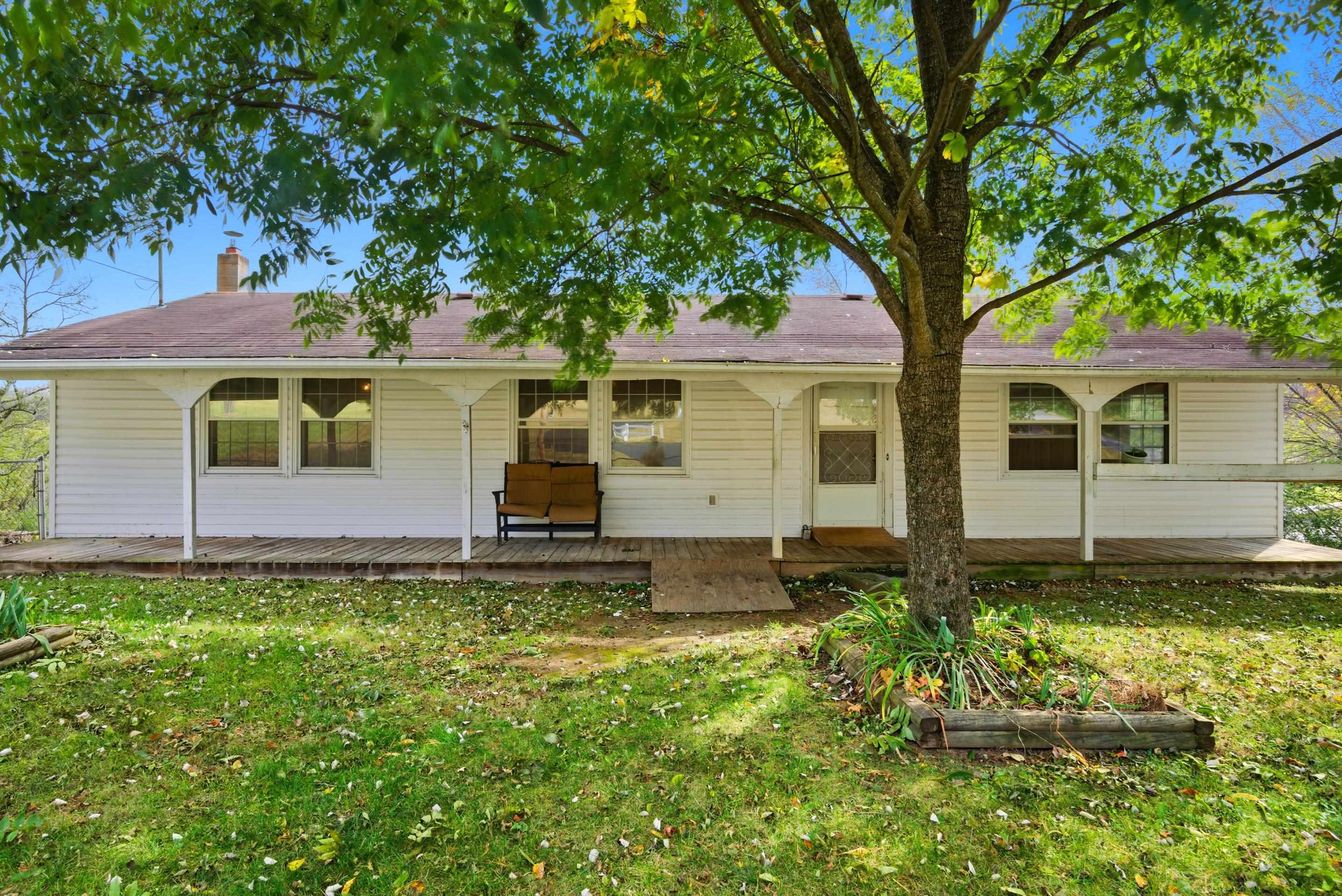 Charming Ranch in Narrows! Welcome home to this inviting 3-bedroom, 2-bath ranch situated on a spacious corner lot. Enjoy easy, one-level living with a roomy living area, bay window, and plenty of natural light. The kitchen offers ample cabinet space and connects easily to the dining area, perfect for family gatherings or casual meals. Step outside to relax on the covered front porch overlooking mature shade trees and a fenced yard with garden space. With a little vision and love this home could really shine! Located within minutes of downtown Narrows, this home offers small-town charm and everyday convenience.