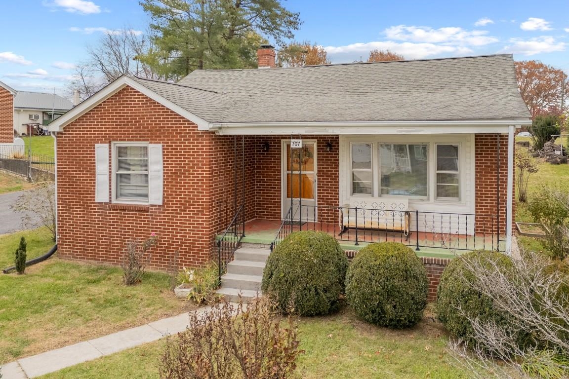 Step into comfort and classic charm with this fantastic original-owner brick home in the heart of Radford! A bright living room with a large picture window welcomes you with natural light and flows into the lovely dining room—perfect for gatherings. The kitchen offers plenty of cabinet and counter space for easy meal prep. Down the hall, three inviting bedrooms share a full bath, offering ideal one-level living. The partially finished basement features a cozy wood-paneled family room, laundry with conveying washer/dryer, a second bath, and abundant space for future expansion or hobbies. Enjoy the corner lot with mature landscaping, paved driveway, and detached garage. Relax on the covered front porch or host BBQs on the back patio overlooking your 0.25-acre yard. Close to Radford University, Wildwood Park, Bisset Park, the Radford Rec Center, and local schools—this lovingly maintained home offers comfort, convenience, and timeless appeal!