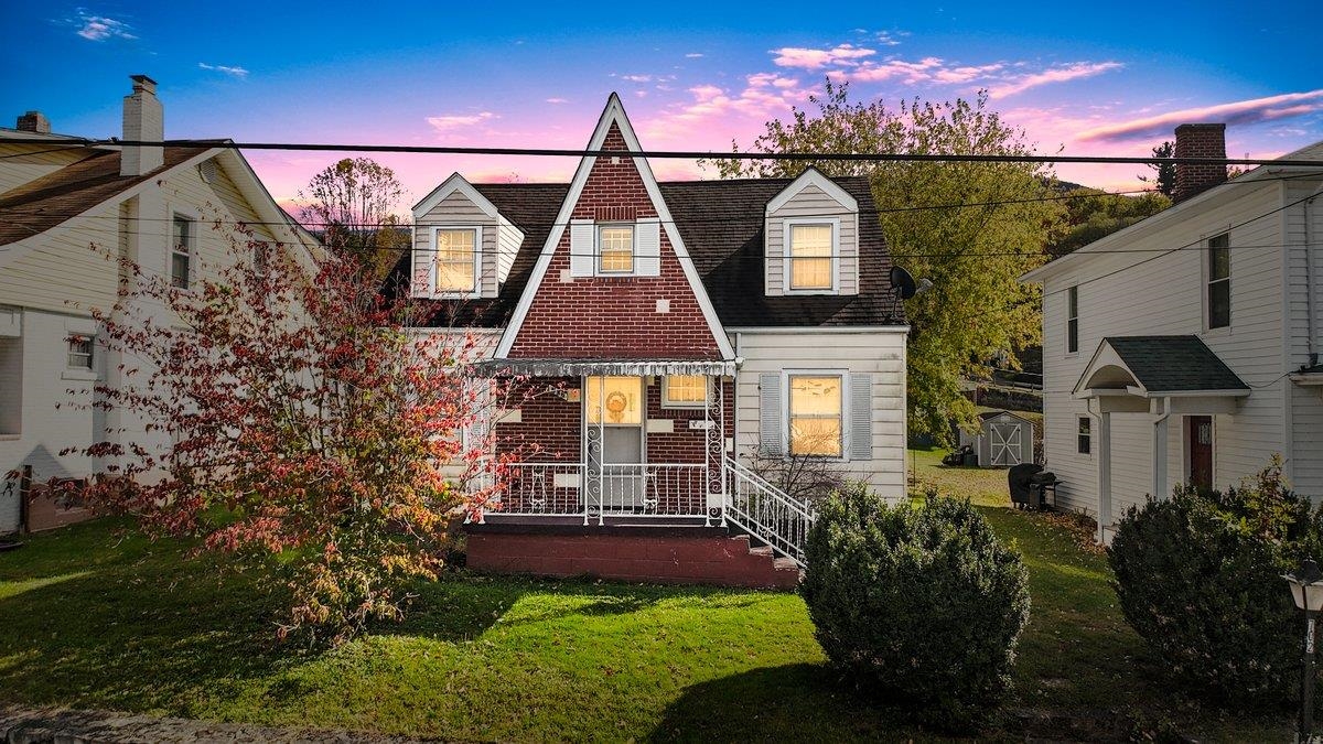 Welcome to this delightful two-level Cape Cod home located in the heart of Narrows. This property offers both comfort and income potential, featuring a primary residence plus a detached rear apartment - perfect for rental income, a guest suite, or a home office. Main home features a spacious 2 level layout, with primary bedroom on main level, and two bedrooms upstairs. Bright living and family areas with plenty of natural light. Full unfinished basement - ideal for storage, a workshop, or future expansion. Detached rear apartment features a separate entrance on Moon Ave, two levels, and two bedrooms. Excellent potential for supplemental income or multi-generational living. Close to local shops, dining, and schools. This versatile property offers endless possibilities. Don't miss this rare opportunity to own a flexible, income producing Cape Cod in a prime location!