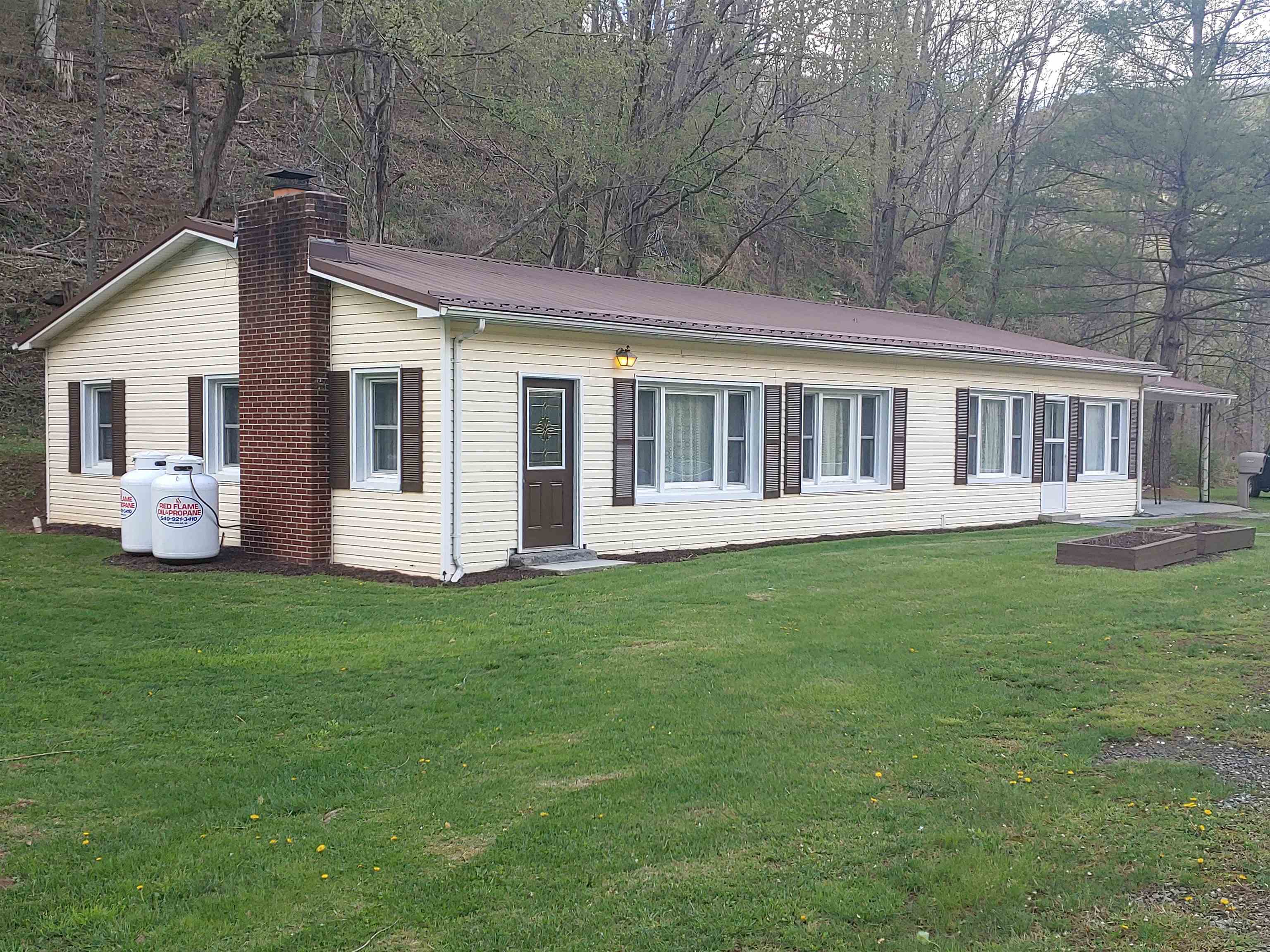 BREATHE!! Is is so refreshing when you find that quite and peaceful home where nature is just outside, and the warmth of home is inside. Peace may come setting beside the fireplace as the snow falls, or listening to the trinkle of the creek nearby, but you know it, it is real! This home, 4680 Wolf Creek Road, is that home where accessibility and relaxation meet. Remodeled with a new electrical service, new flooring, drywall, lighting, heat pump and more.....it is calling...are you listening. The home features replacement windows and a metal roof, and the bathroom has a walk in tub that is perfect for those needing the extra care. The spacious kitchen and dining area provide ample room for family enjoyments and special memories. Outside, you will find a nice flat yard with a storage building and the double carport is great for protecting your vehicles or just having friends over to talk. Could this be your home? Come on over and take a look-you will be impressed.