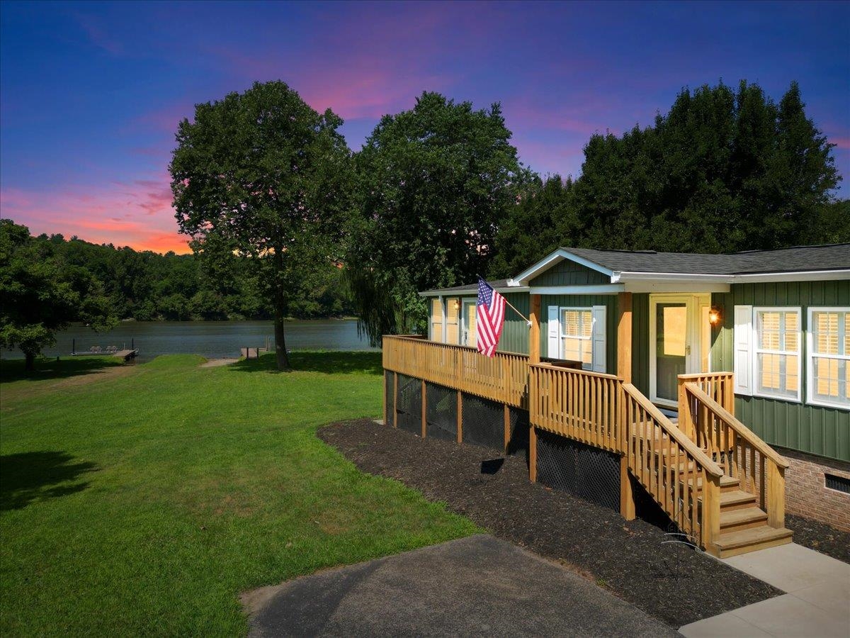 The lifestyle you have been waiting for at this perfect staycation home! Beautifully updated home on New River is move-in ready for those who dream of waterfront living, or perfect investment property or Airbnb as everything in the home conveys (furniture, dishes, etc.)! Enjoy a NEW gourmet kitchen, NEW flooring, NEW plantation shutters, elegant moldings, stone accents, butcher block counters, modern lighting/fixtures, plus NEW vinyl siding & exceptional outdoor living spaces! designed to maximize the beautiful riverfront views, the spacious sunroom also lets in loads of natural light and is likely to be your new favorite spot! Relish in outdoor living at its best in your own backyard… oversized deck, floating, boating and fishing with a dock & ramp! Imagine long, warm summer days basking in the sun, cooling off in the river and getting cozy under a starry sky! Nearby New River Trail to hike and bike. Living here will make you feel like you are on vacation year ‘round.