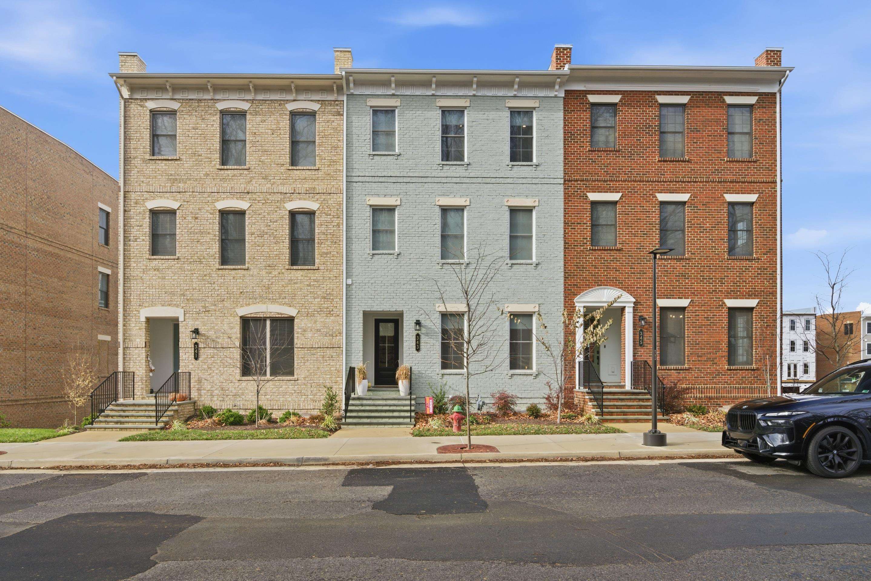 Discover luxury living in the heart of Midtown Blacksburg with this stunning four-level townhome that blends modern design with timeless style. The entry level features 10' ceilings, an open layout flowing from the dining area to the kitchen and living room, then out to a spacious deck with beautiful downtown and mountain views. The third floor is dedicated to the primary suite, complete with a spa-like bath, expansive walk-in closet, and convenient laundry access. The top level includes a media room that opens to a covered rooftop terrace with a NanoWall, custom wet bar, fireplace for year-round enjoyment, along with a third bedroom & full bath. The lower basement level offers a private bedroom and full bath, plus a two-car rear garage with additional driveway parking. Home has electric blinds throughout and easy access to each floor with a personal elevator. Perfectly positioned just minutes away from shops, dining, VT campus, and recreation! Call your agent today for a private tour.